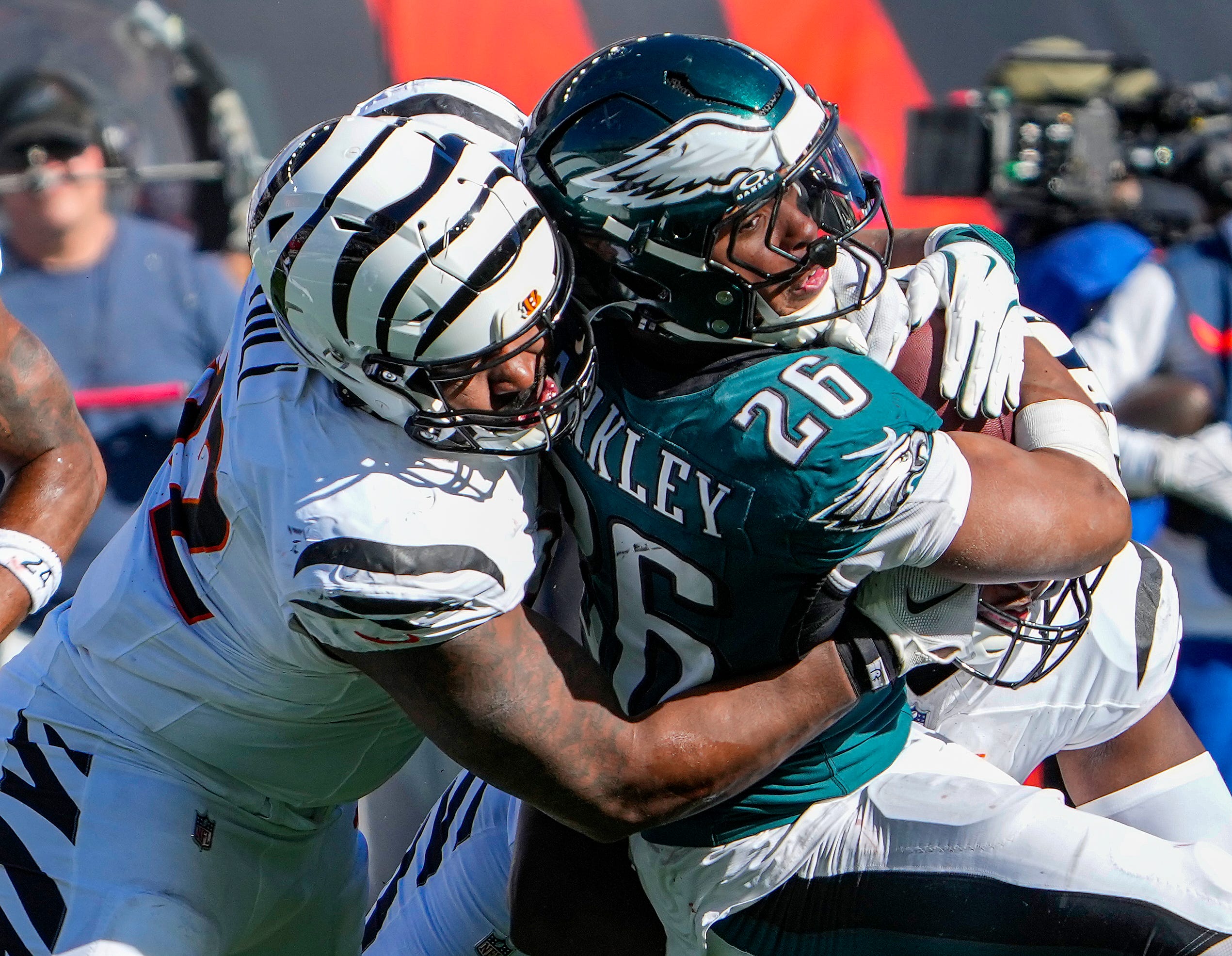 Cincinnati Bengals defensive tackle B.J. Hill (92) tackles Philadelphia Eagles running back Saquon Barkley (26) in the 2nd quarters NFL Week 8 matchup at Paycor Stadium Sunday October 27, 2024. The Bengals lost 37-17 and remain winless at home.