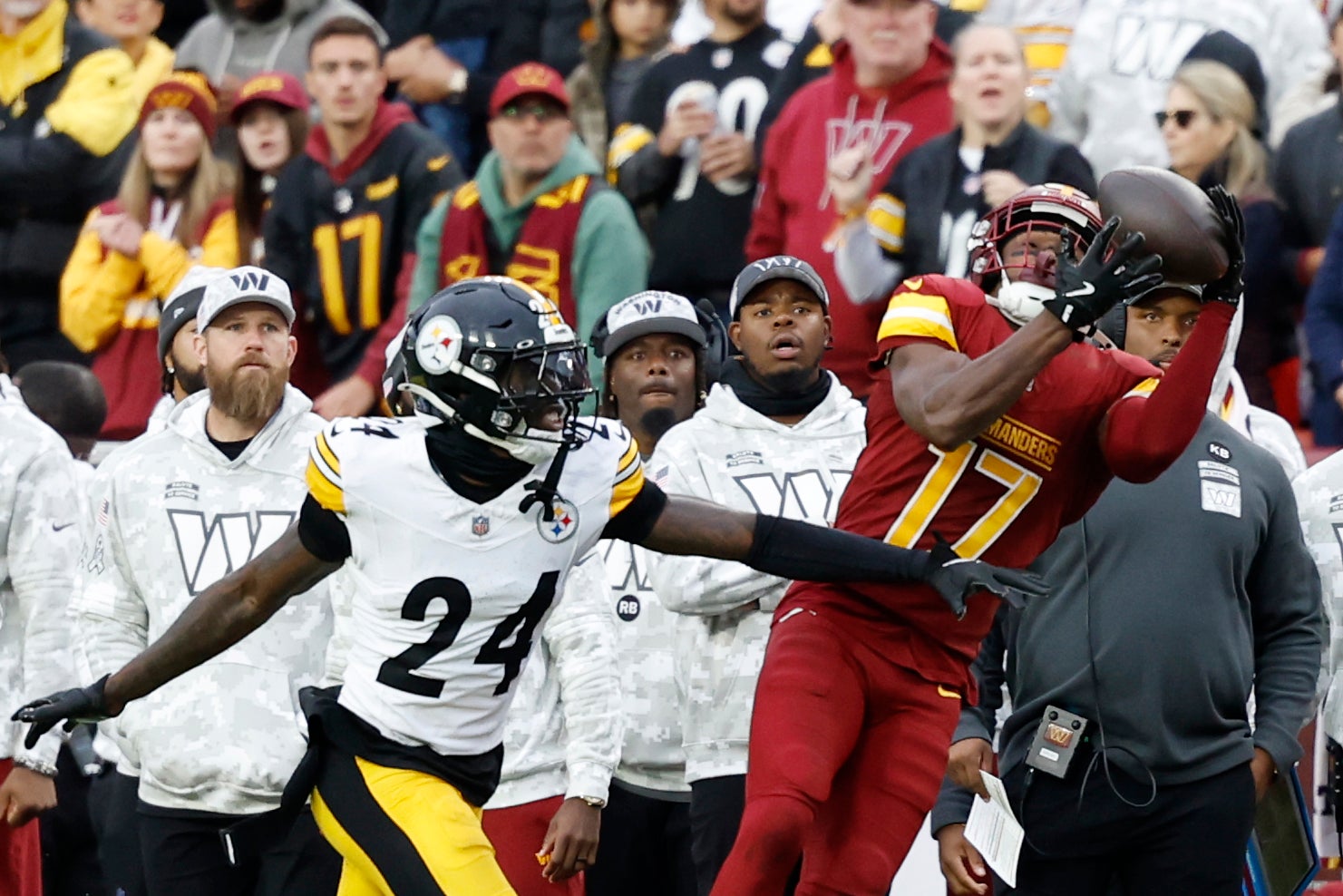 Nov 10, 2024; Landover, Maryland, USA; Washington Commanders wide receiver Terry McLaurin (17) catches a pass as Pittsburgh Steelers cornerback Joey Porter Jr. (24) defends during the second half at Northwest Stadium.