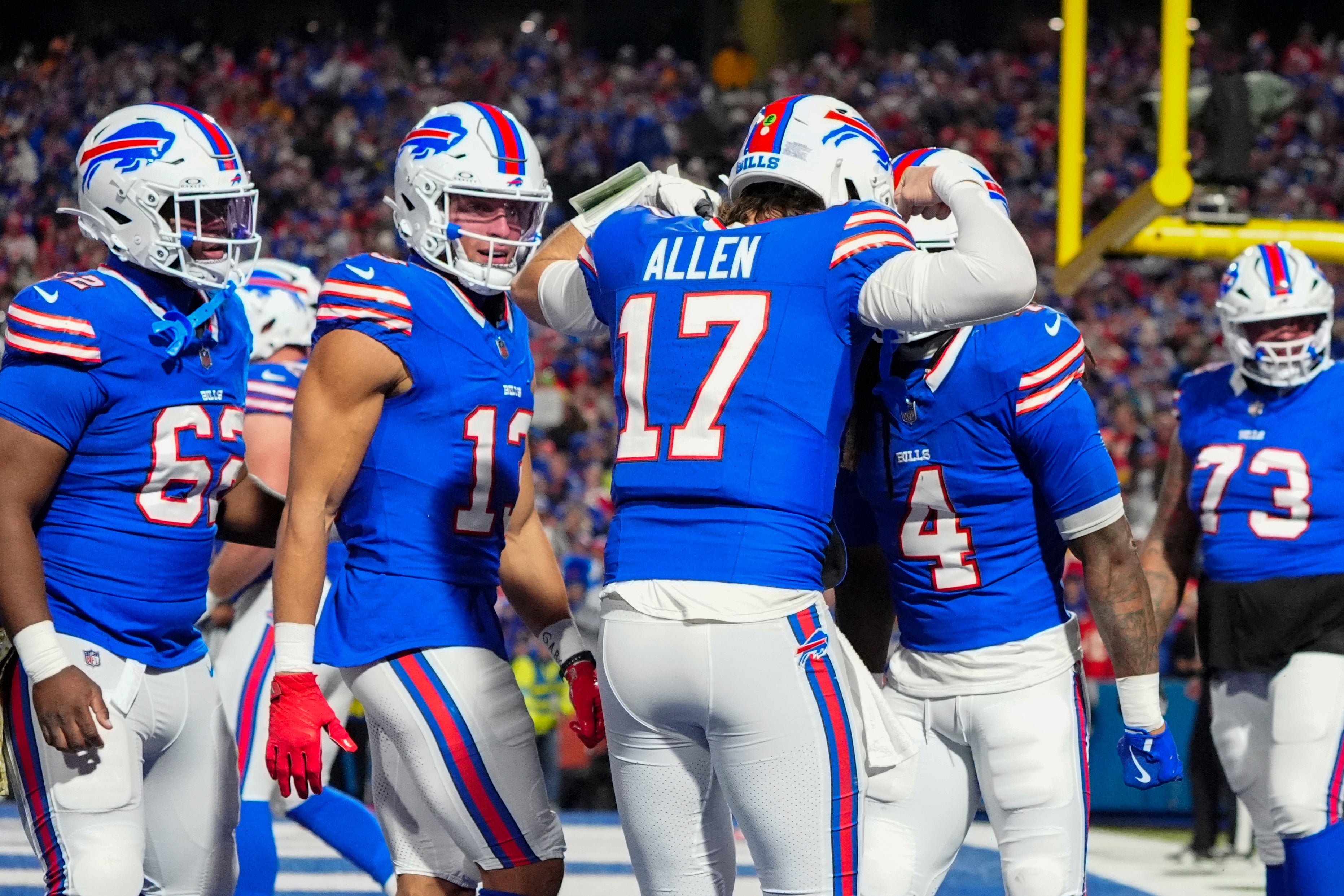 Buffalo Bills QB Josh Allen celebrates with RB James Cook