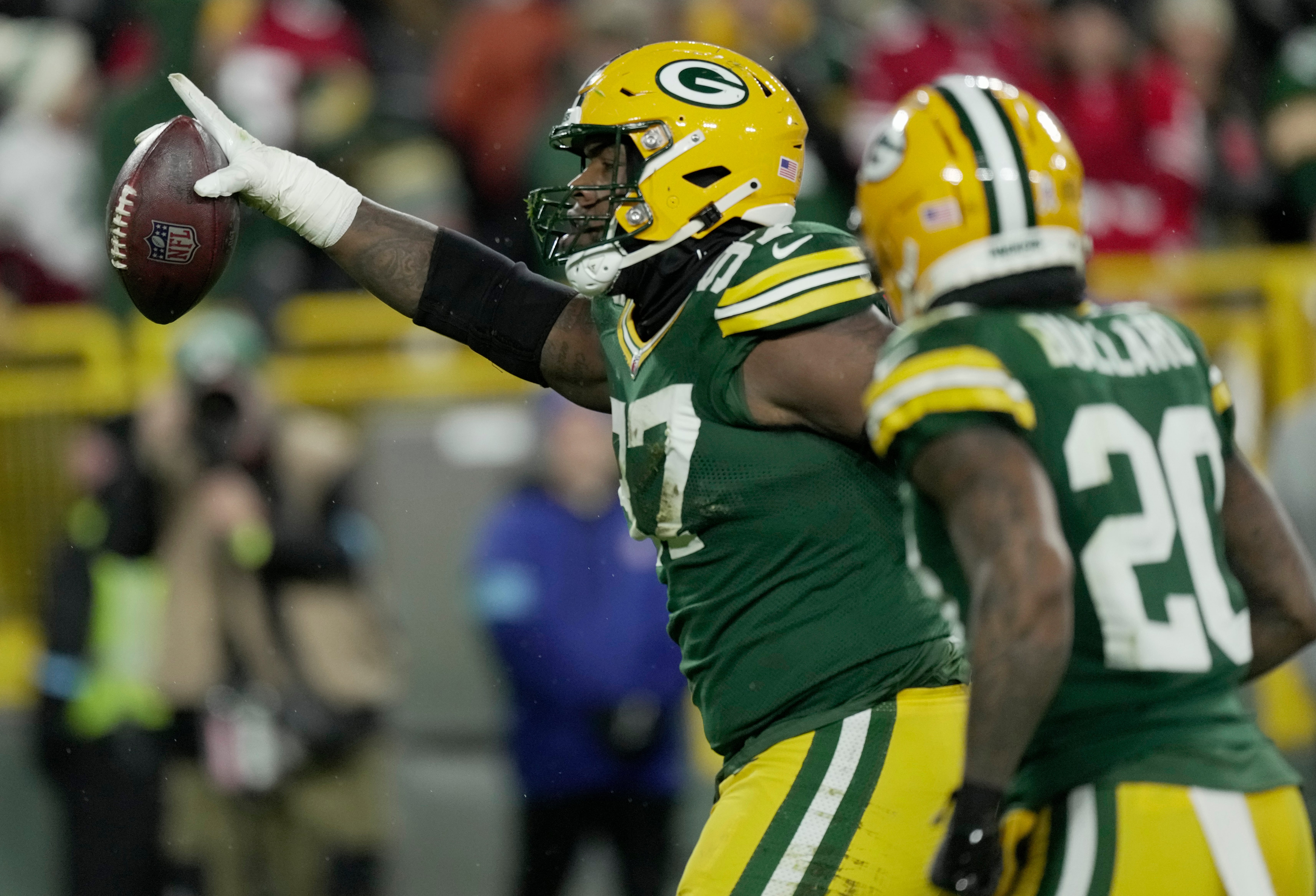 Green Bay Packers defensive tackle Kenny Clark (97) celebrates recovering a fumble by San Francisco 49ers quarterback Brandon Allen during the fourth quarter of their game Sunday, November 24, 2024 at Lambeau Field in Green Bay, Wisconsin.