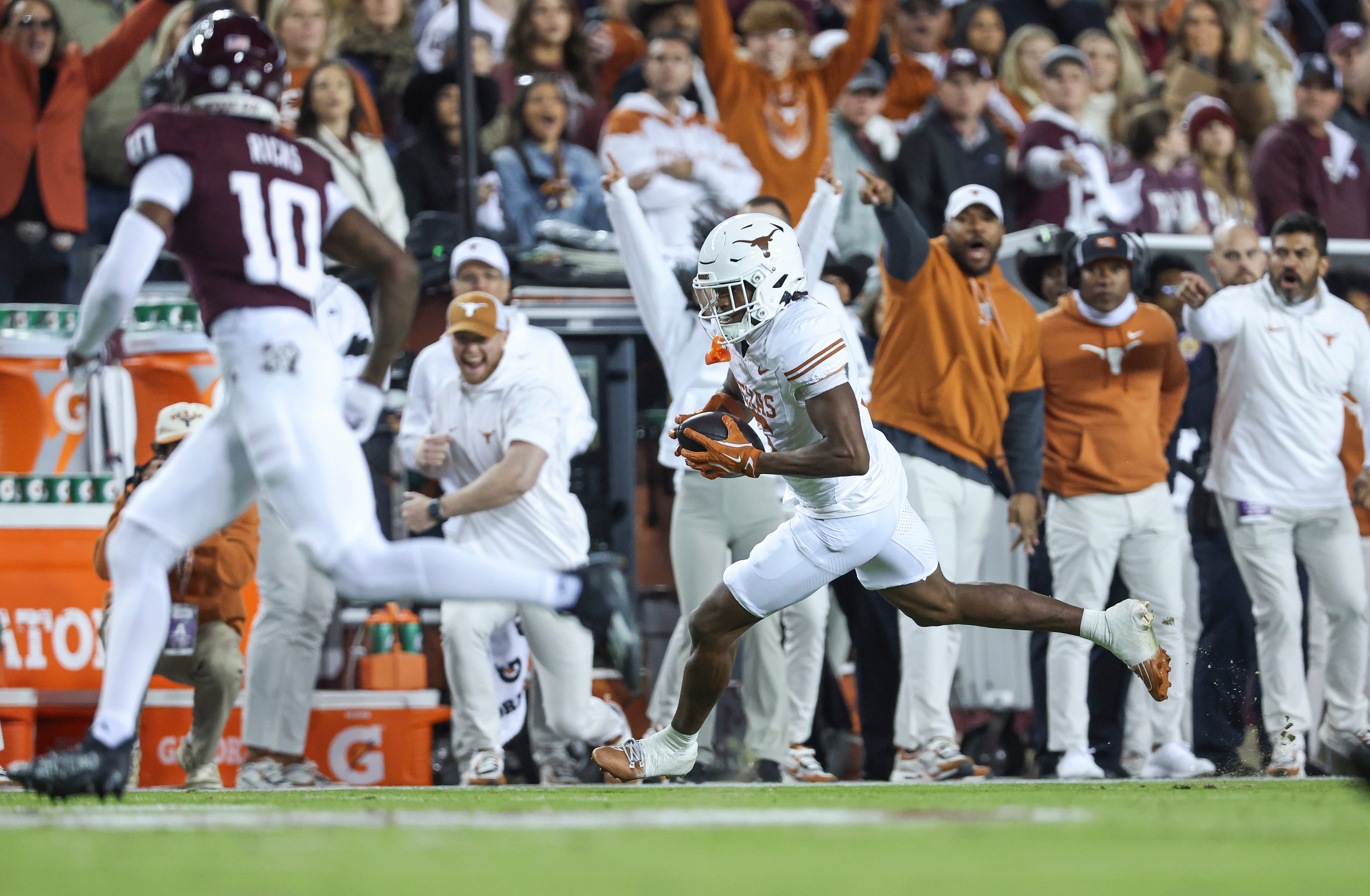 Nov 30, 2024; College Station, Texas, USA; Texas Longhorns wide receiver Ryan Wingo (5) runs with the ball after a reception during the second quarter against the Texas A&M Aggies at Kyle Field.
