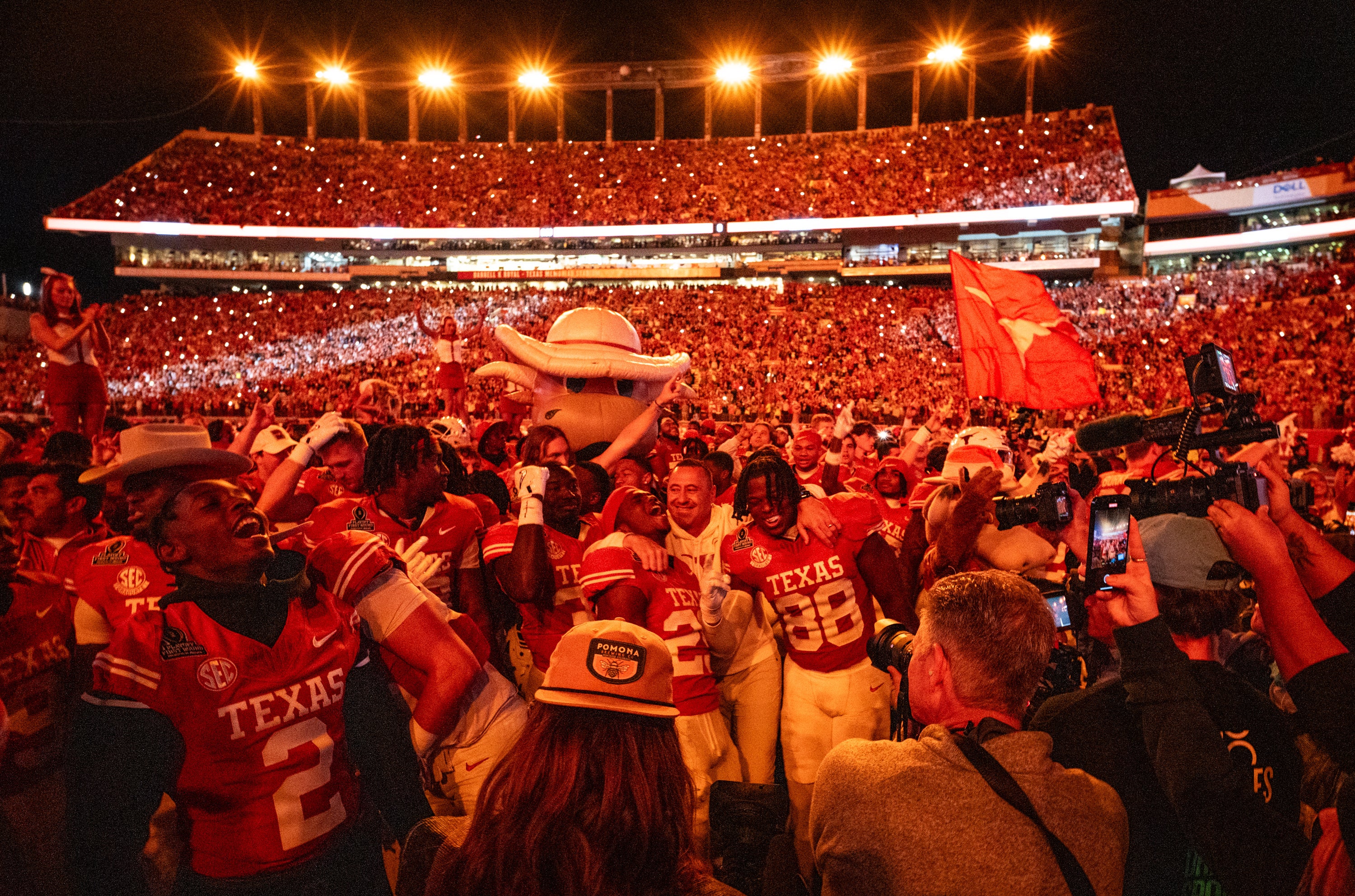 Dec 21, 2024; Austin, Texas, USA; Texas Longhorns players celebrate after beating the Clemson Tigers in the first round of the College Football Playoffs at Darrell K Royal Texas Memorial Stadium.