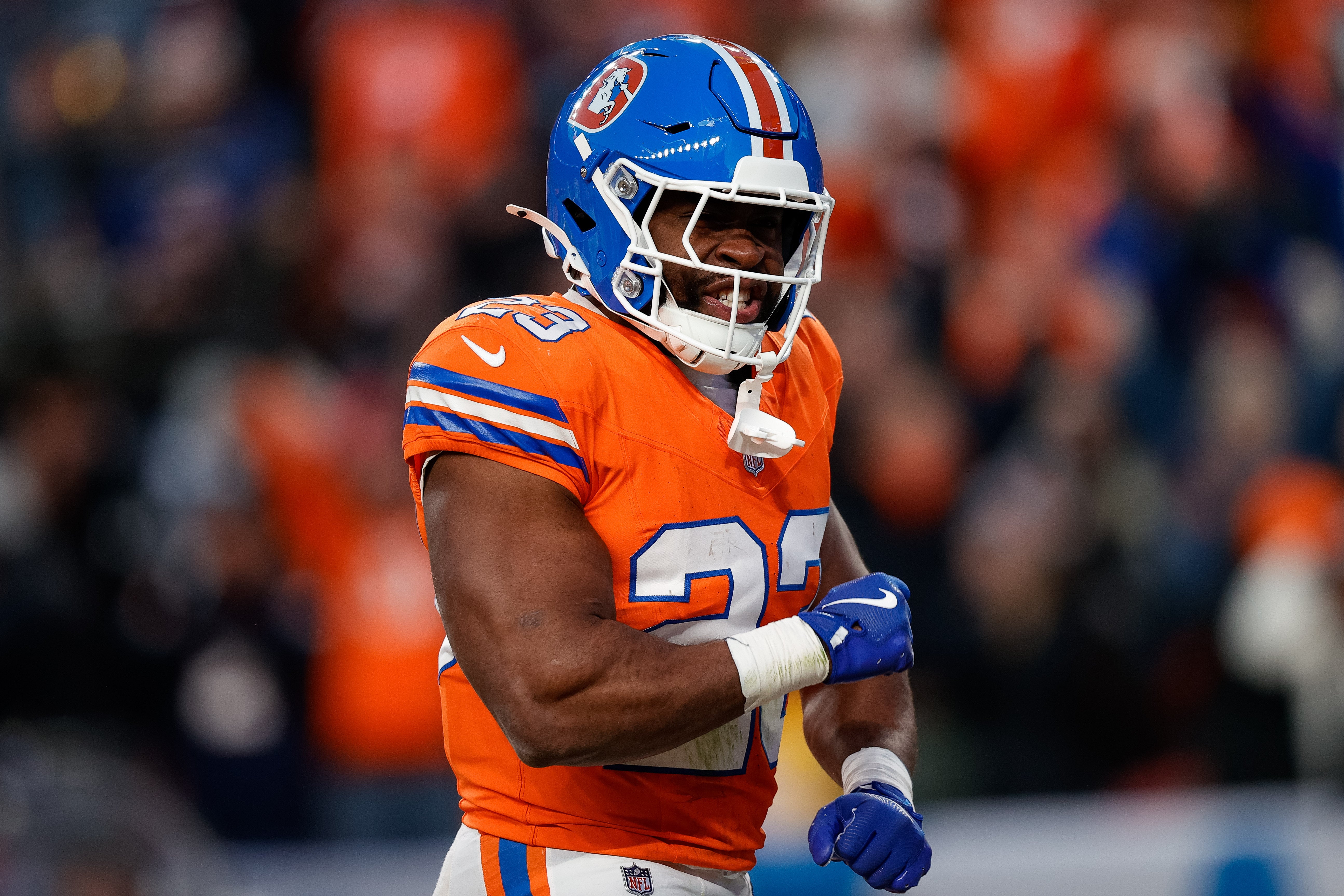Jan 5, 2025; Denver, Colorado, USA; Denver Broncos running back Audric Estime (23) celebrates after a touchdown in the fourth quarter against the Kansas City Chiefs at Empower Field at Mile High.