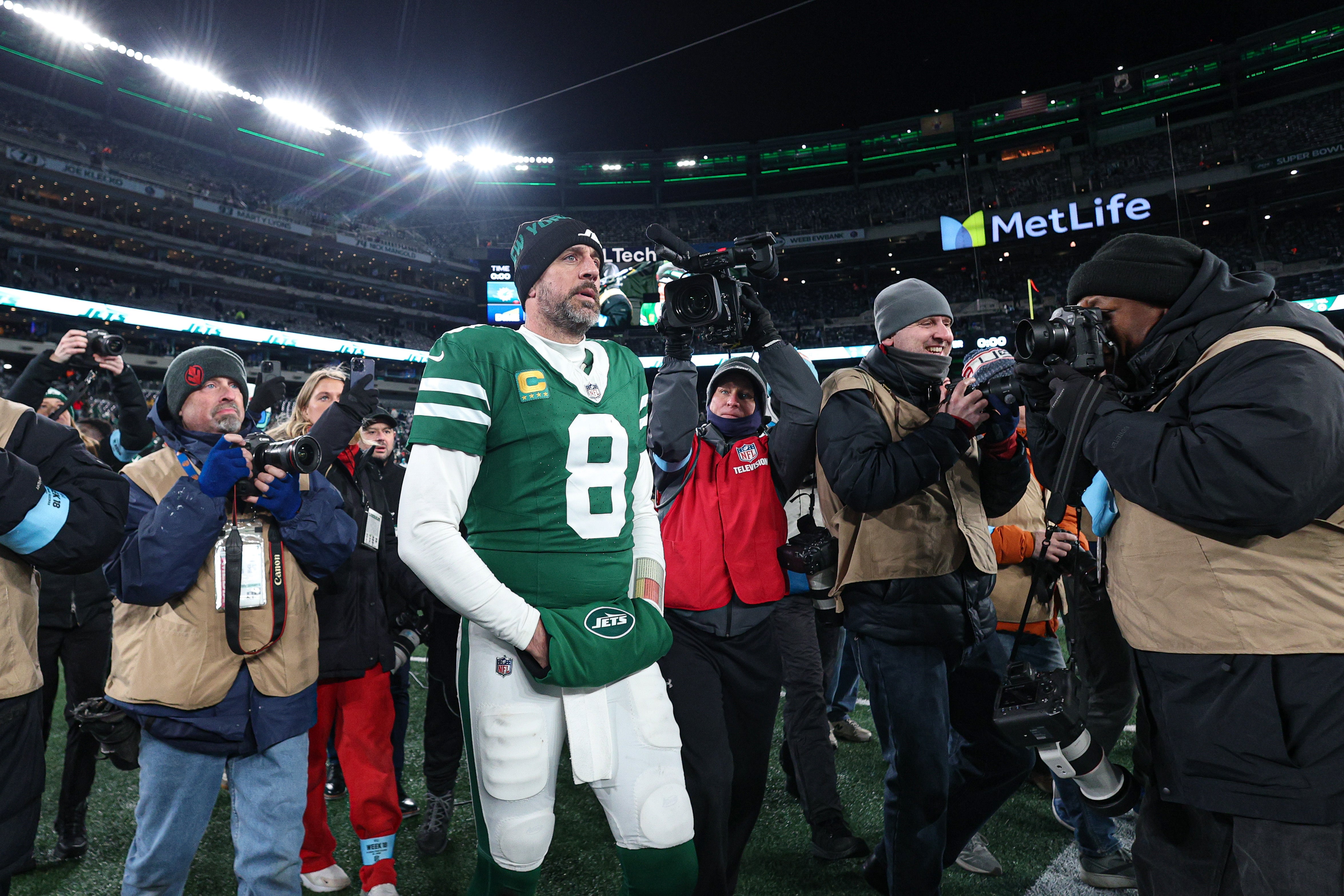 Jan 5, 2025; East Rutherford, New Jersey, USA; New York Jets quarterback Aaron Rodgers (8) walks on the field after the game against the Miami Dolphins at MetLife Stadium.