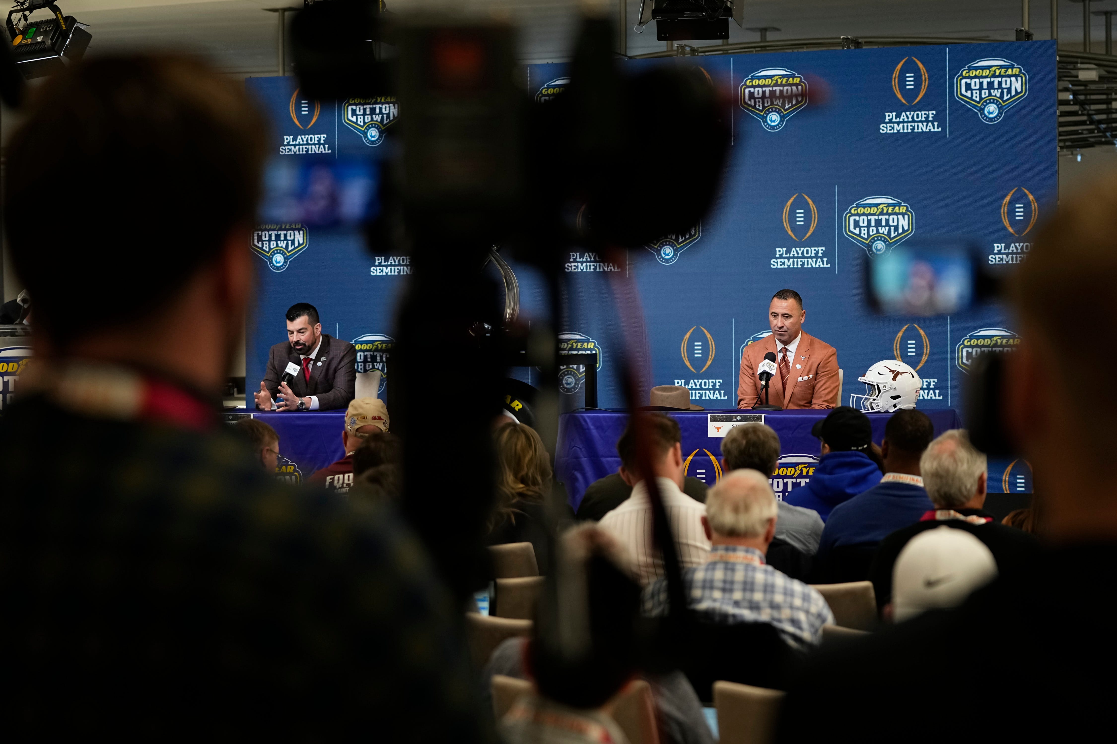 Ohio State Buckeyes head coach Ryan Day and Texas Longhorns head coach Steve Sarkisian speak during a press conference at AT&T Stadium prior to the College Football Playoff semifinal at the Cotton Bowl Classic in Arlington, Texas on Jan. 9, 2025.