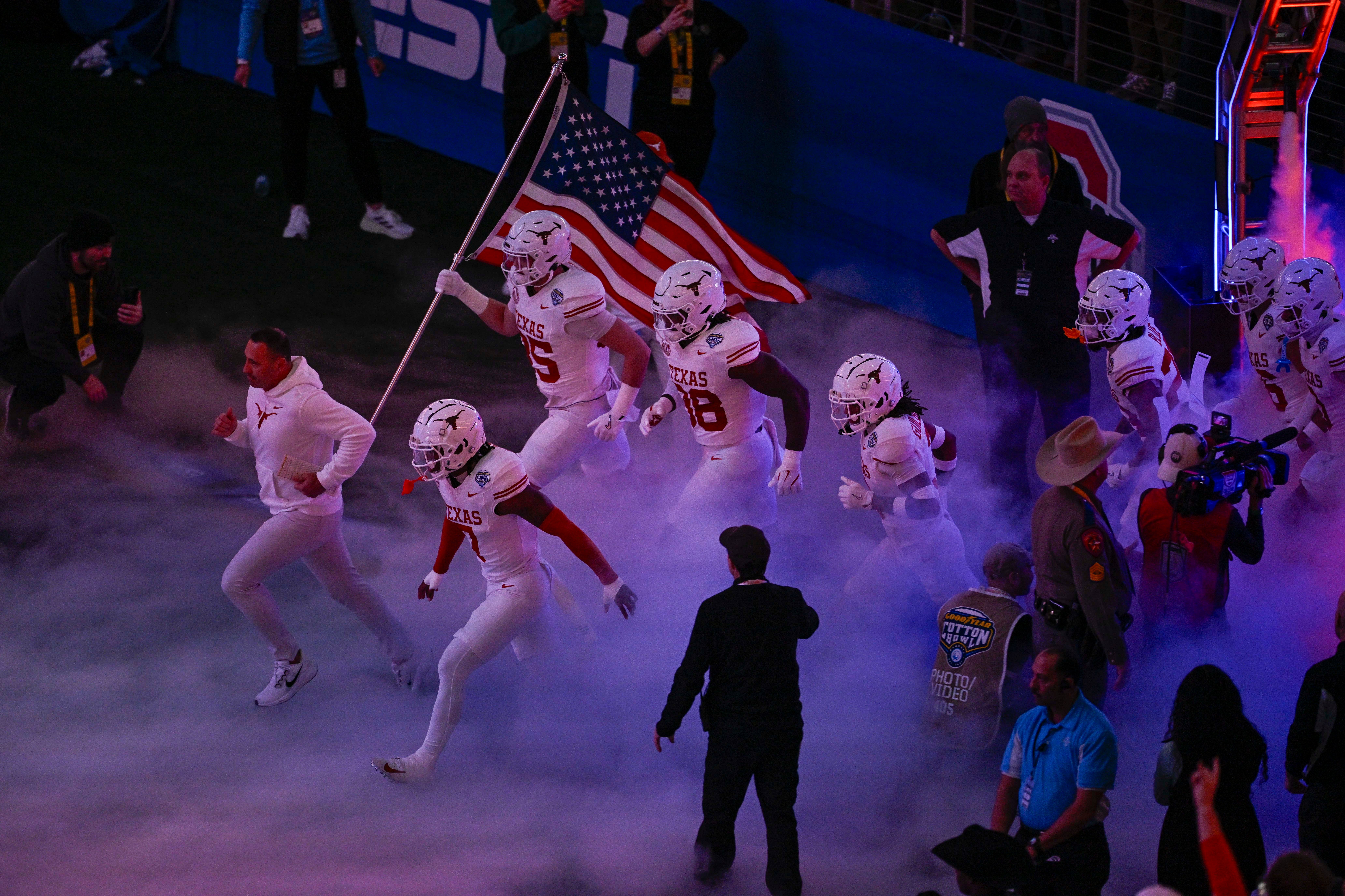 Jan 10, 2025; Arlington, TX, USA; The Texas Longhorns team takes the field before the game between the Texas Longhorns and the Ohio State Buckeyes at AT&T Stadium.