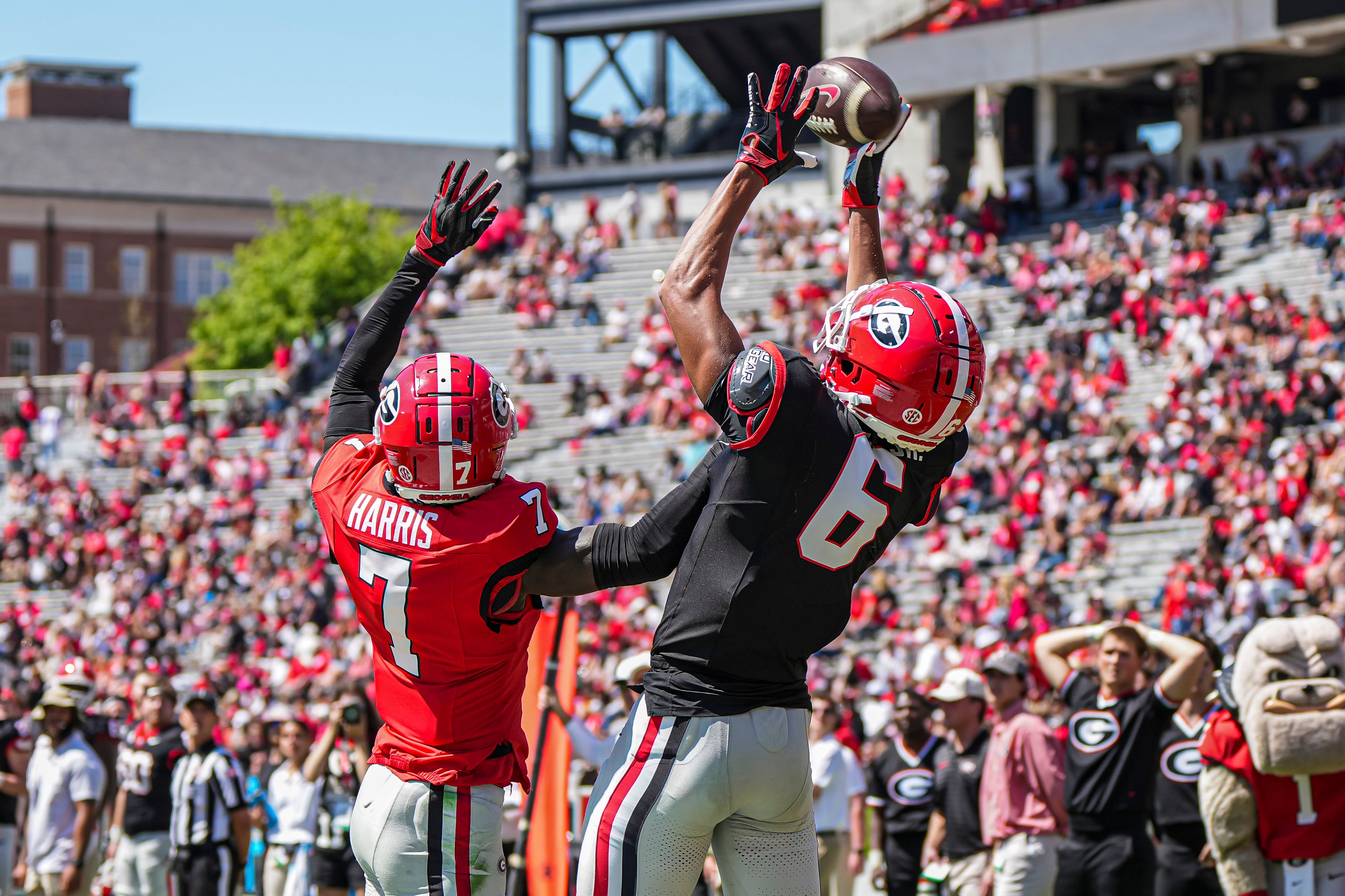 Georgia Bulldogs wide receiver CJ Wiley (6) tries to make a catch behind defensive back Daniel Harris (7) during the Georgia Spring game at Sanford Stadium. Dale Zanine-Imagn Images