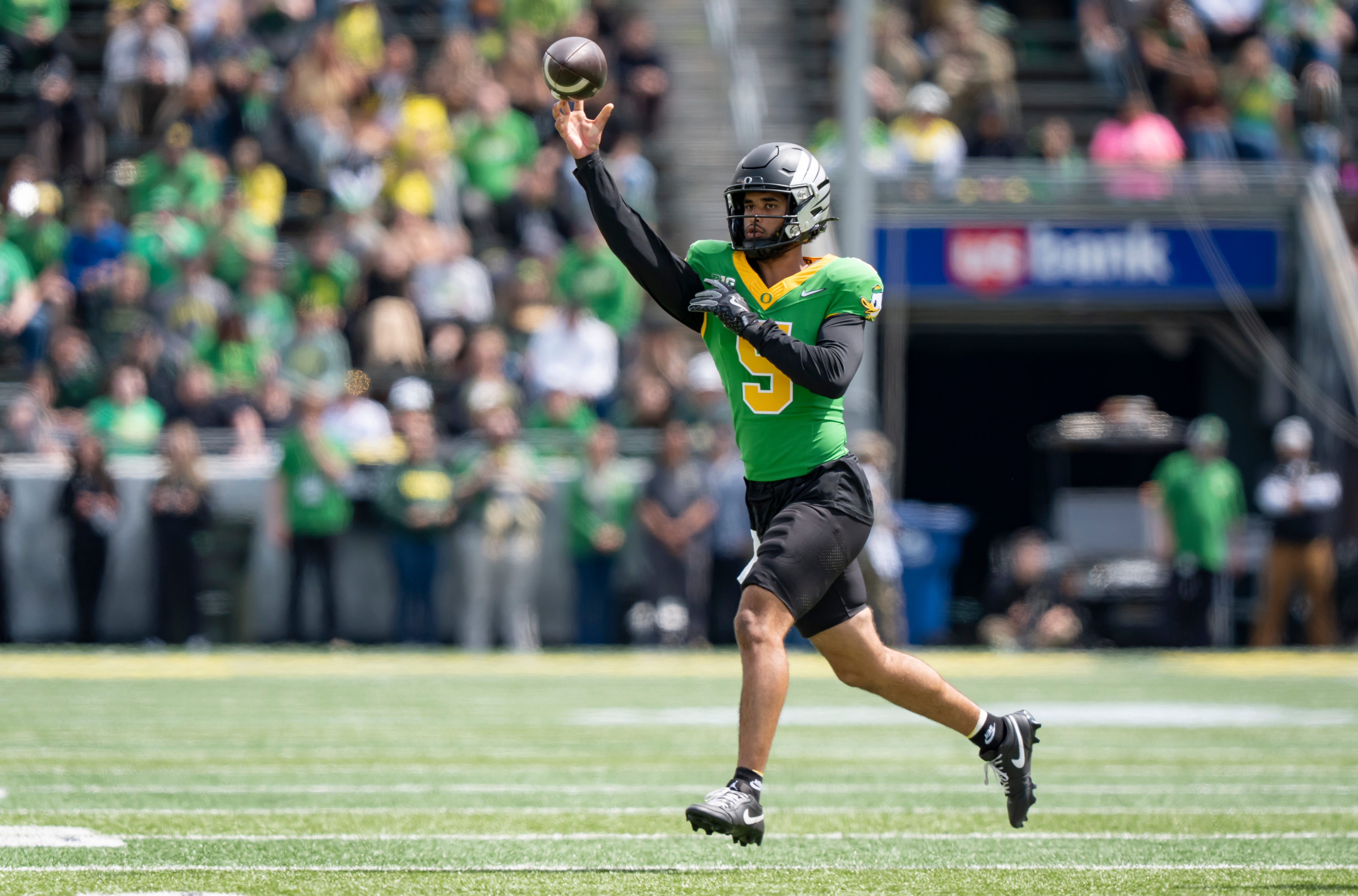 Fighting Ducks quarterback Dante Moore throws out a pass as the Fighting Ducks face off against Mighty Oregon in the Oregon Ducks spring game on April 26, 2025, at Autzen Stadium in Eugene.