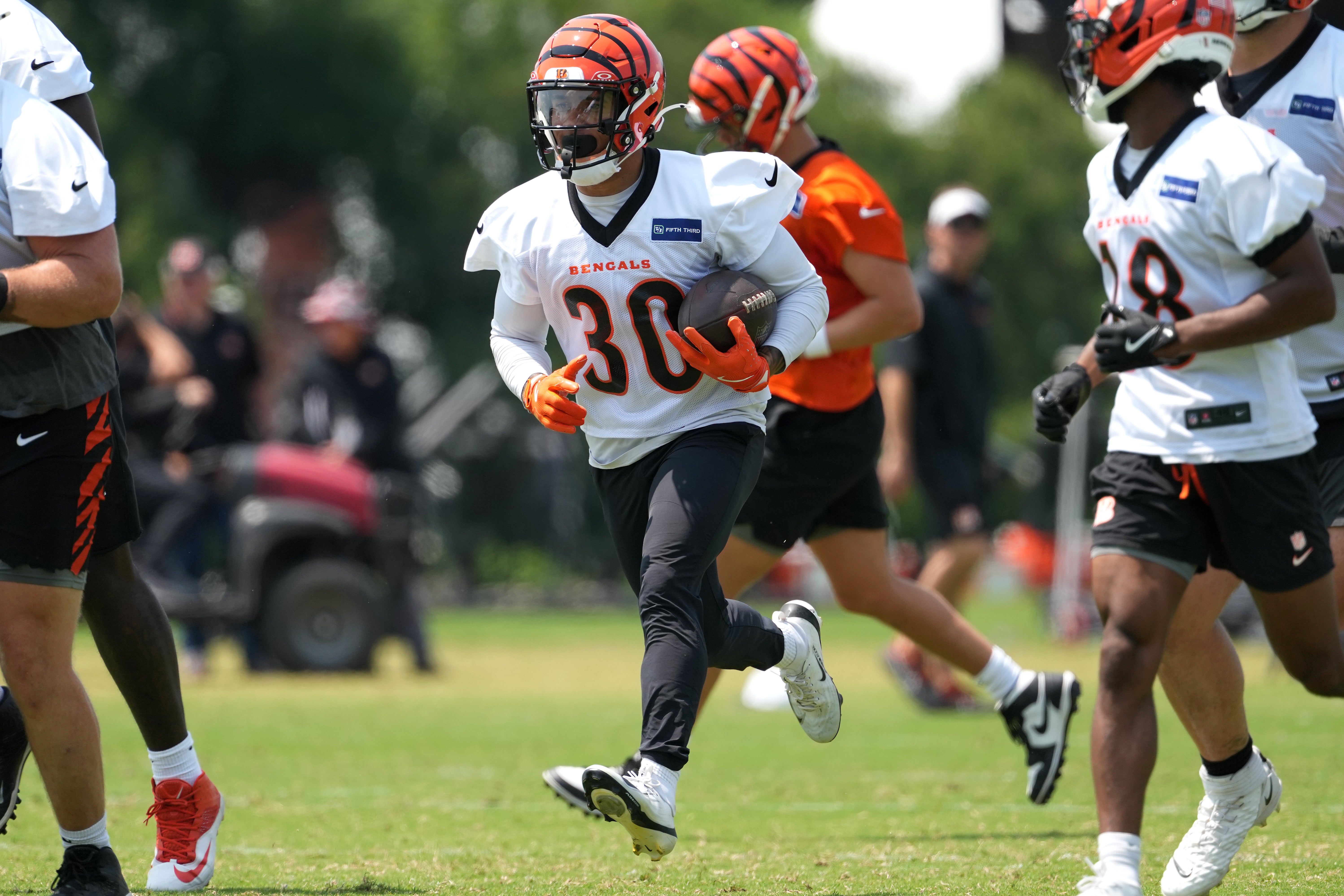 Jun 10, 2025; Cincinnati, OH, USA; Cincinnati Bengals running back Chase Brown (30) carries the ball during practice at Paycor Stadium.