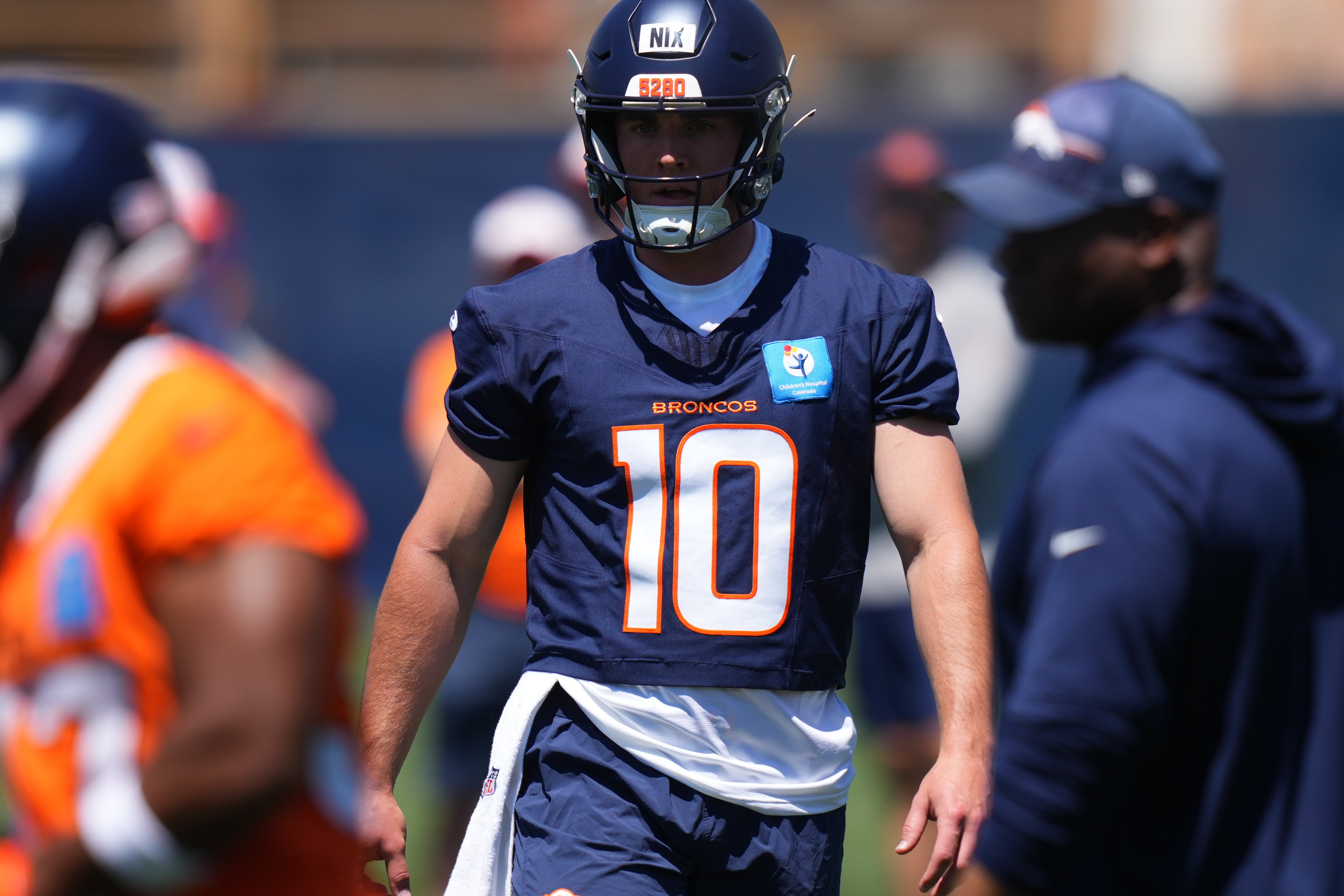Denver Broncos QB Bo Nix participates in drills during training camp