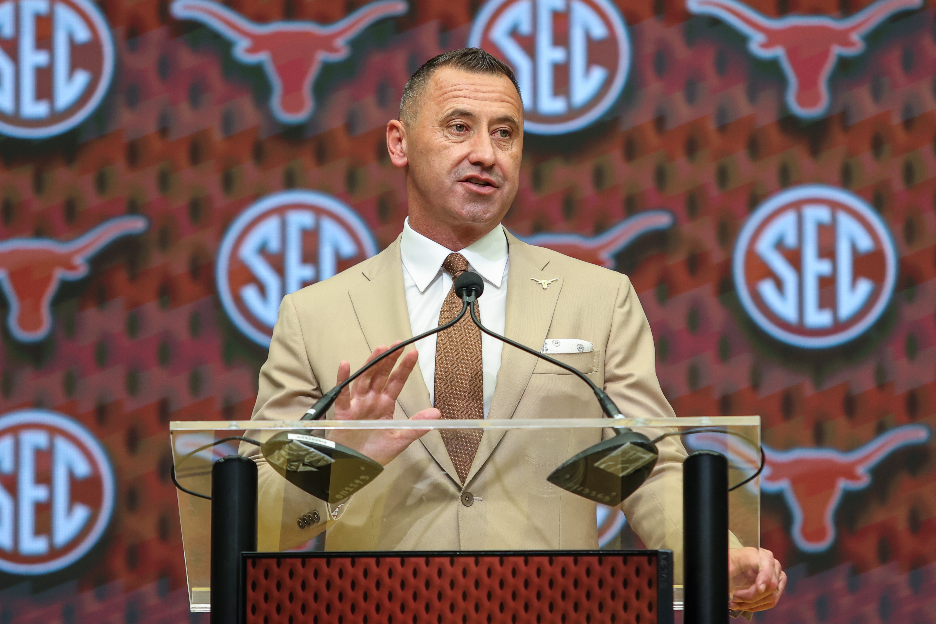 Jul 15, 2025; Atlanta, GA, USA; Texas Longhorns head coach Steve Sarkisan talks to the media during SEC Media Days at Omni Atlanta Hotel. Mandatory Credit: