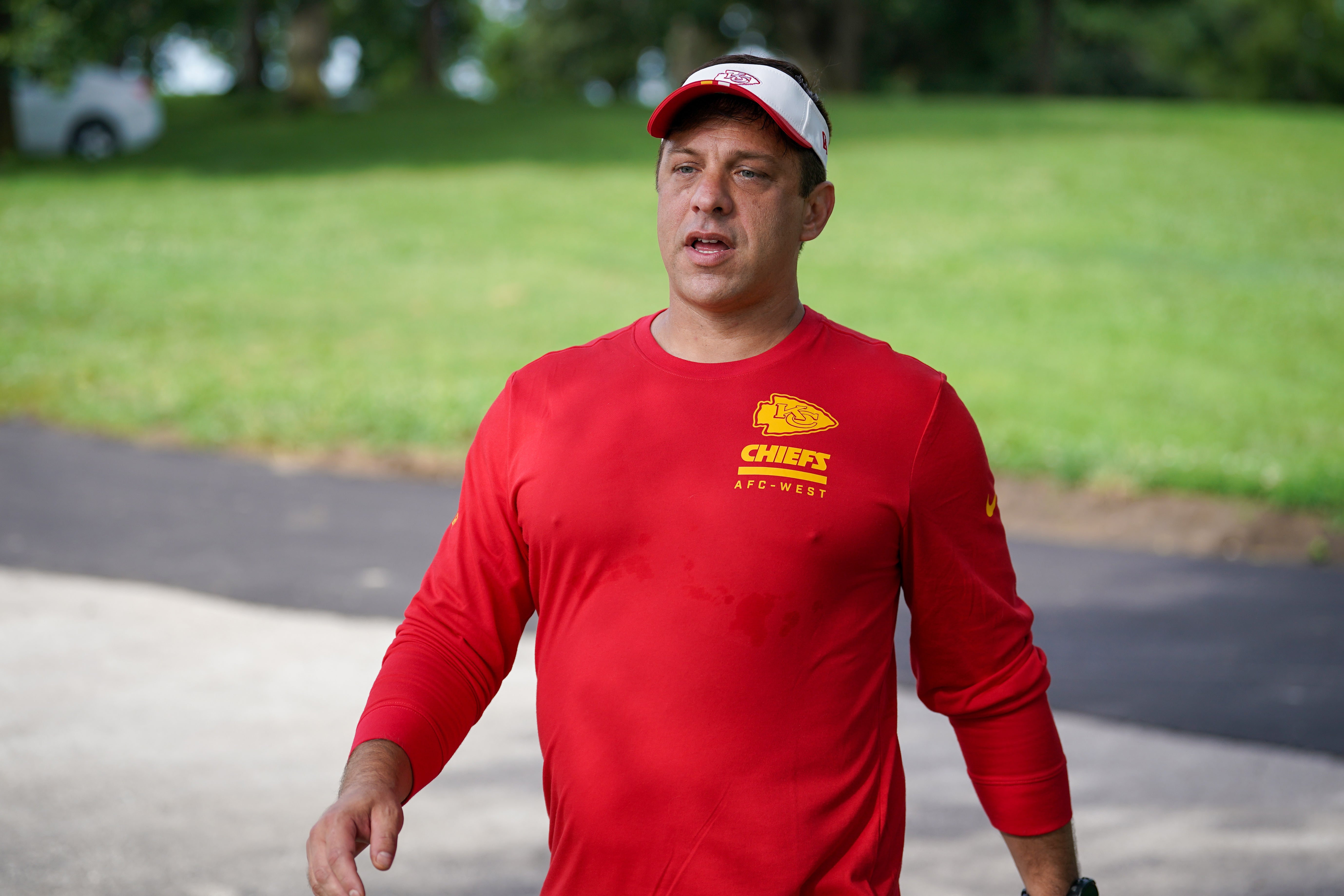 Kansas City Chiefs general manager Brett Veach walks down the hill to the fields during training camp at Missouri Western State University.
