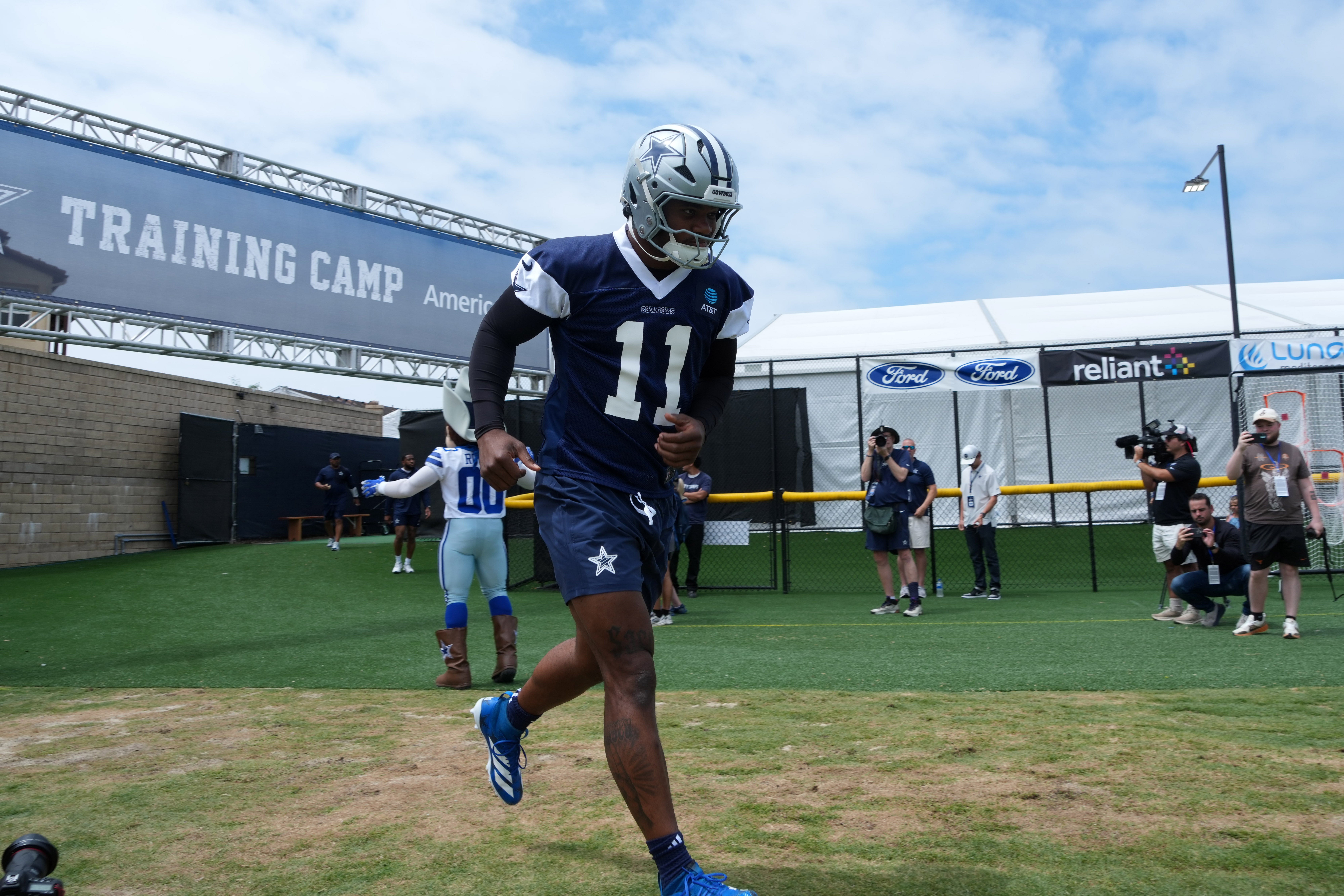 Dallas Cowboys defensive end Micah Parsons (11) enters the field during training camp at the River Ridge Fields.
