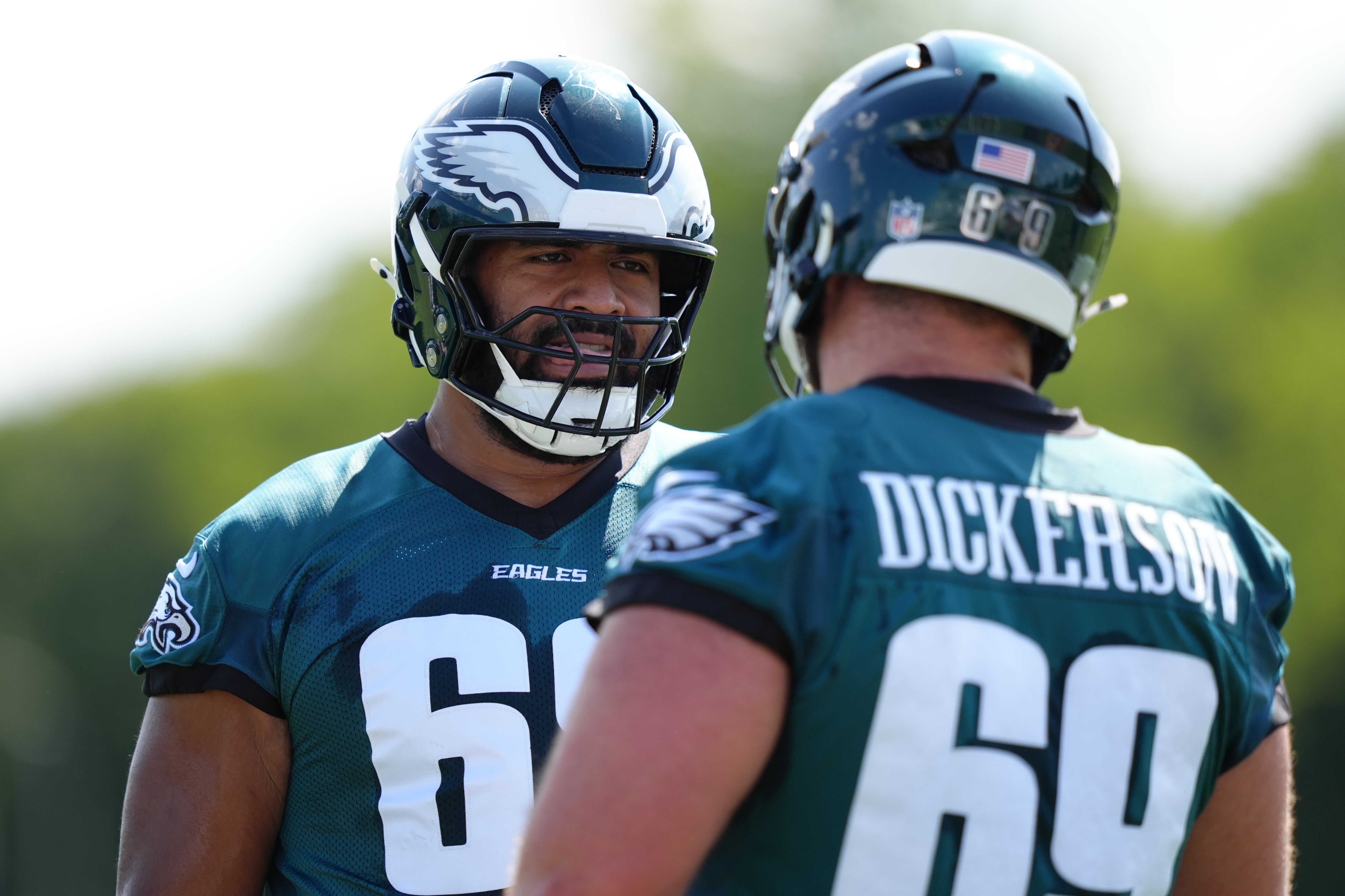 Philadelphia Eagles offensive lineman Jordan Mailata (68) looks to offensive lineman Landon Dickerson (69) during training camp at NovaCare Complex.