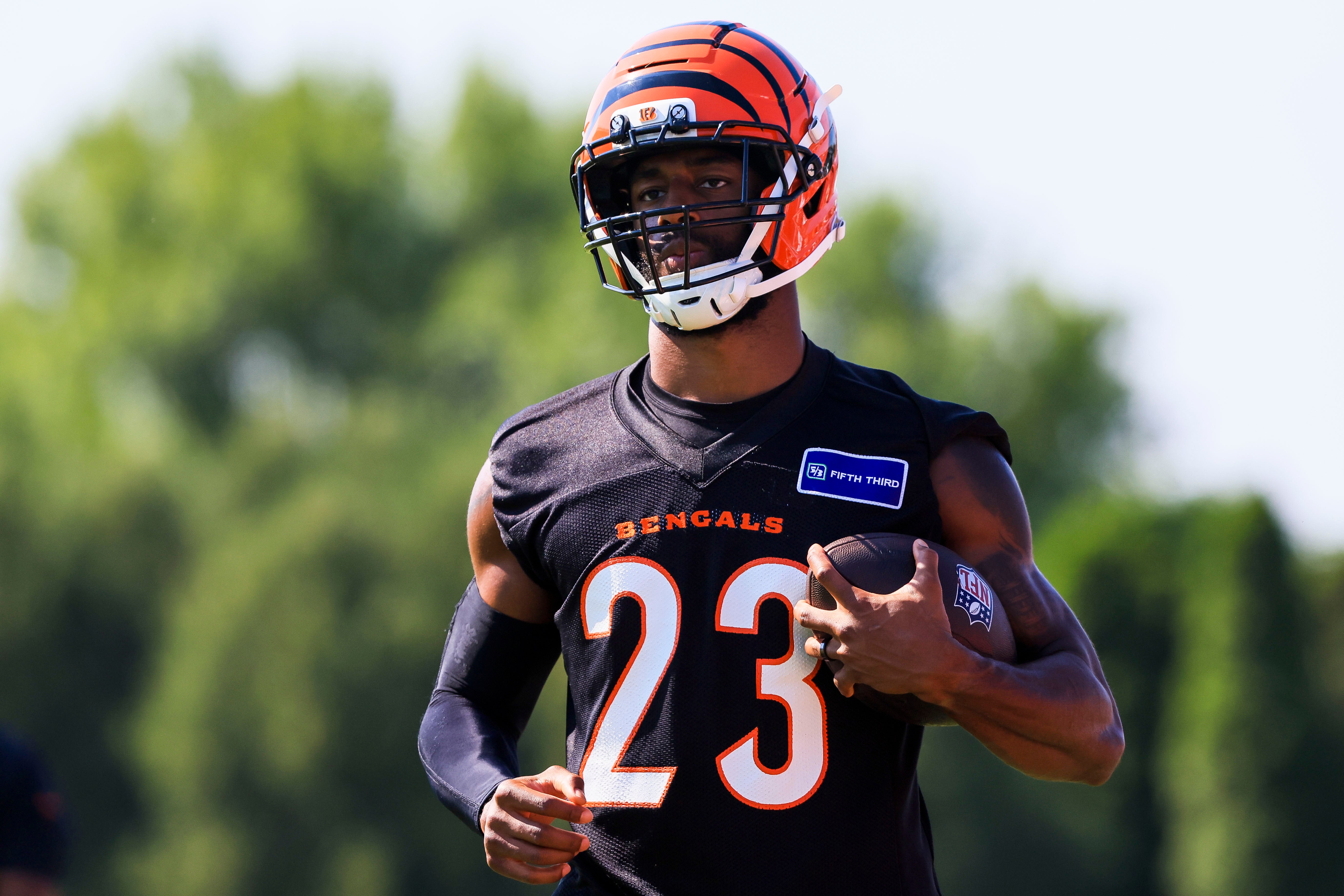 Jul 23, 2025; Cincinnati, OH, USA; Cincinnati Bengals cornerback Dax Hill (23) runs with the ball during training camp at Kettering Health Practice Field.