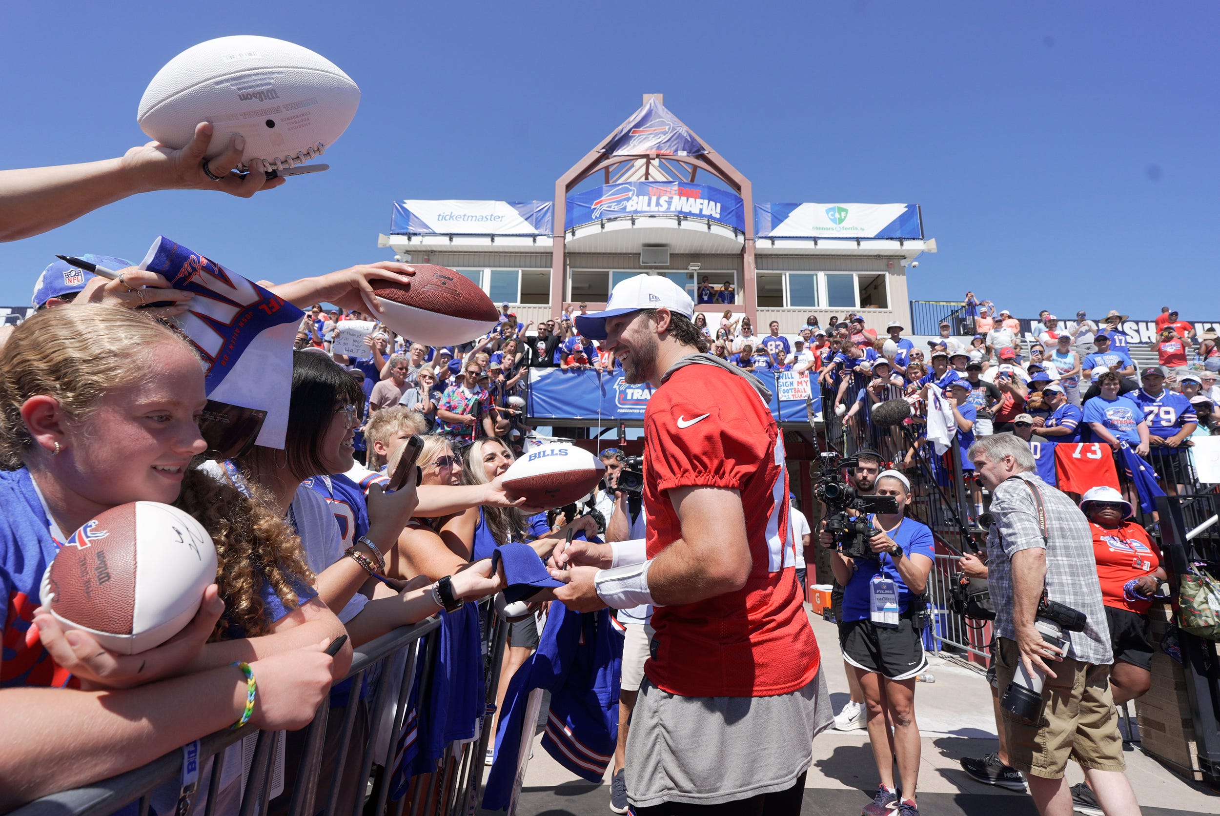 Buffalo Bills QB Josh Allen signs autographs for fans outside training camp practice at St John Fischer University