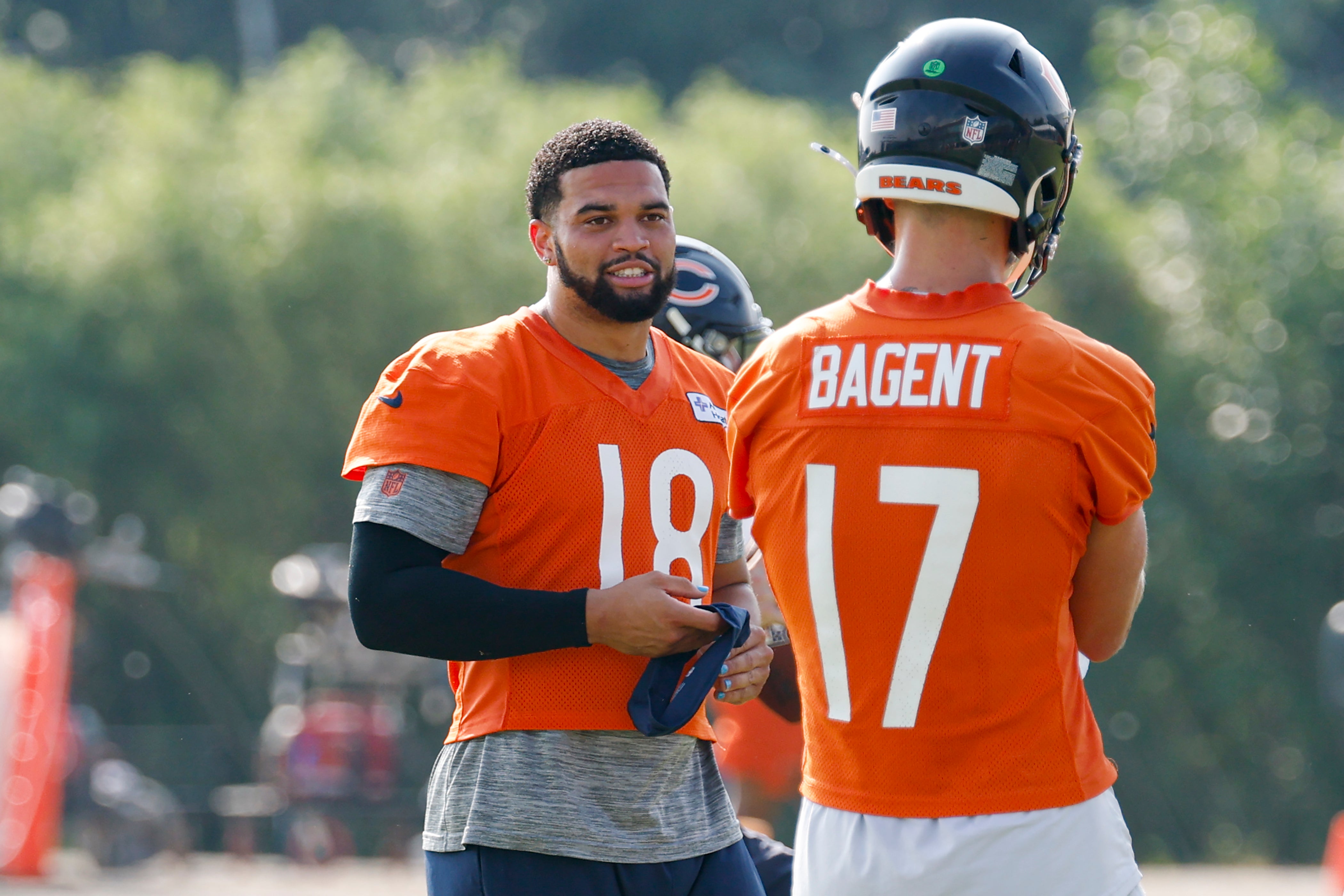 Jul 23, 2025; Lake Forest, IL, USA; Chicago Bears quarterback Caleb Williams (18) chats with quarterback Tyson Bagent (17) during training camp at Halas Hall.