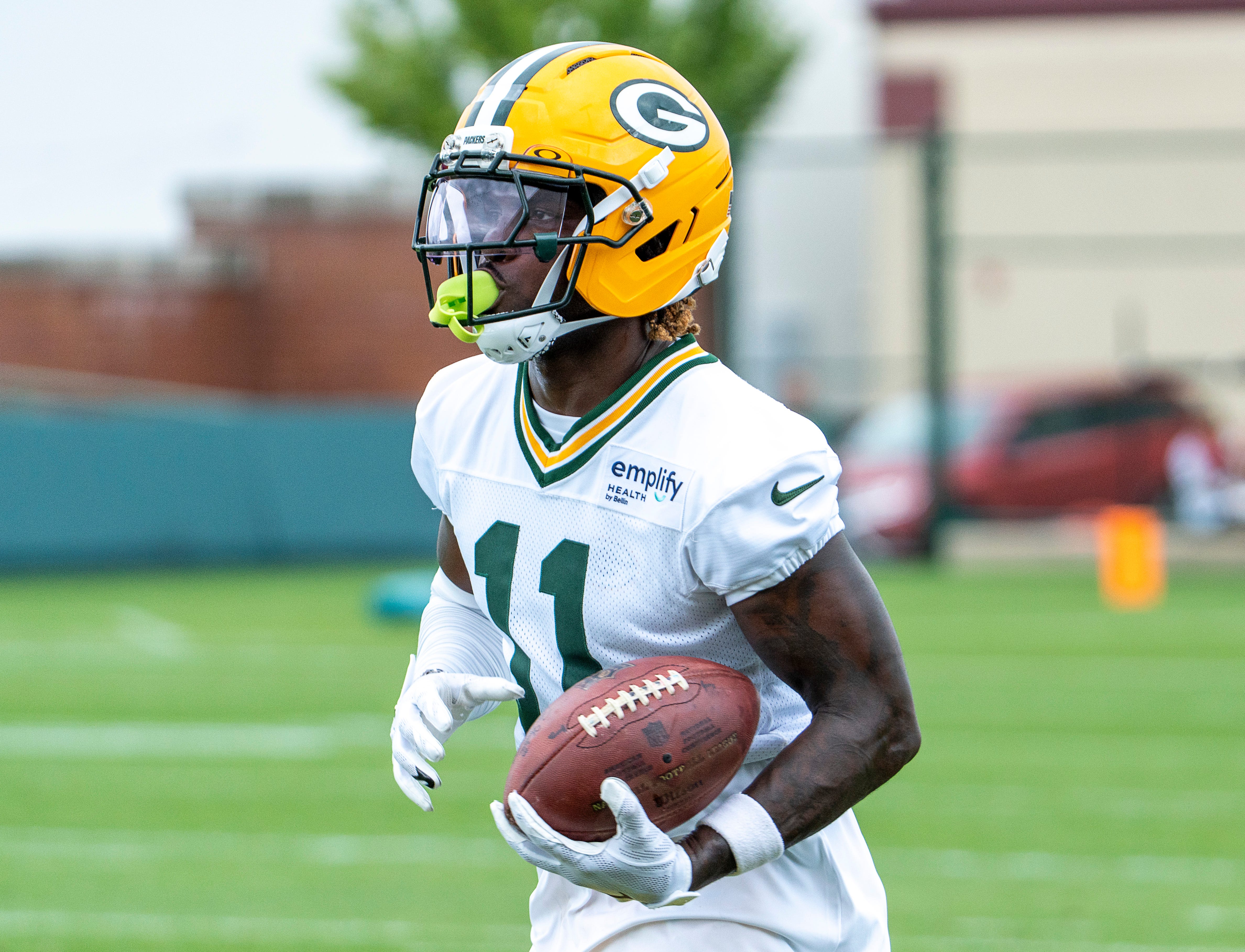 Green Bay Packers wide receiver Jayden Reed (11) runs through a drill during the second day of training camp on Thursday, July 24, 2025, at Ray Nitschke Field in Ashwaubenon, Wis.