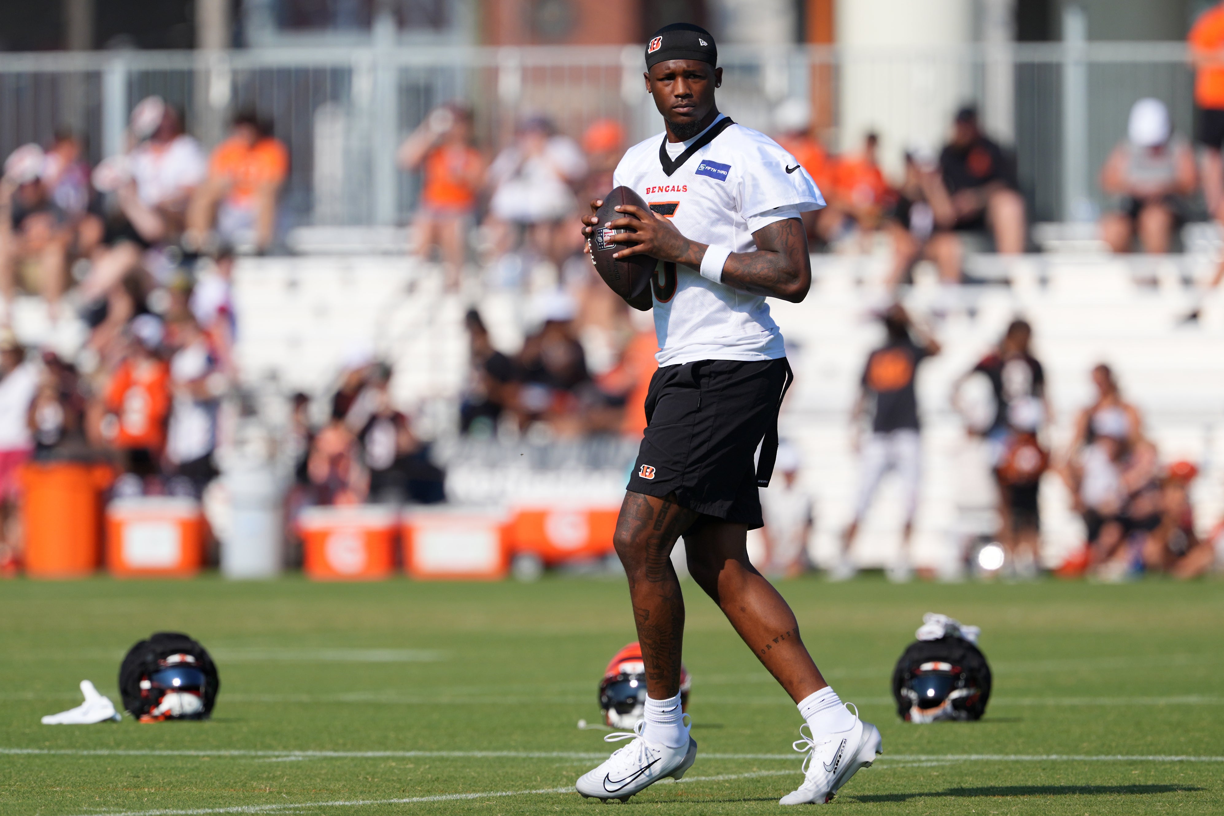 Jul 25, 2025; Cincinnati, OH, USA; Cincinnati Bengals wide receiver Tee Higgins (5) tosses a football during training camp practice.