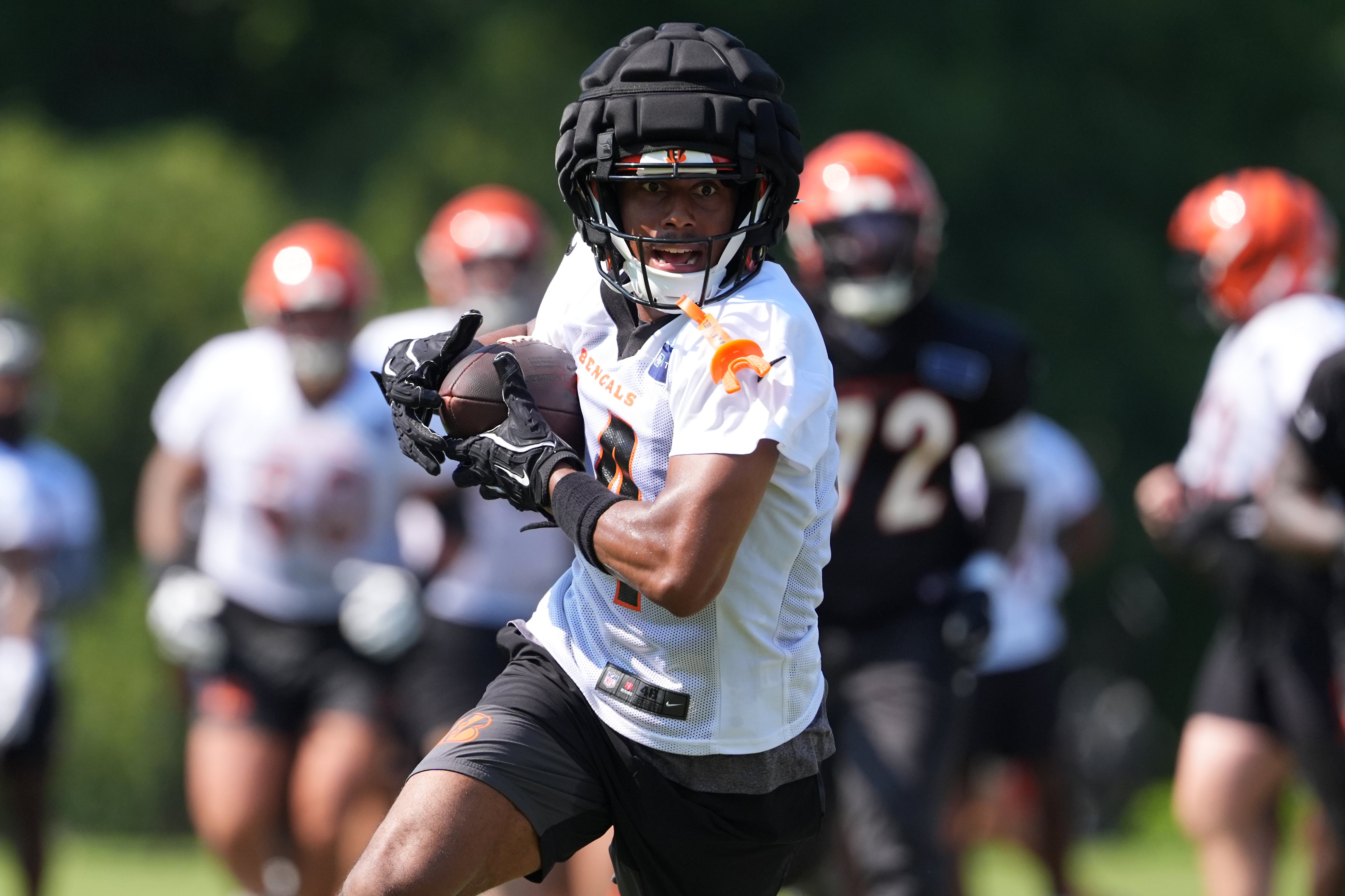 Jul 25, 2025; Cincinnati, OH, USA; Cincinnati Bengals wide receiver Jordan Moore (14) turns downfield after completing a catch during training camp practice.