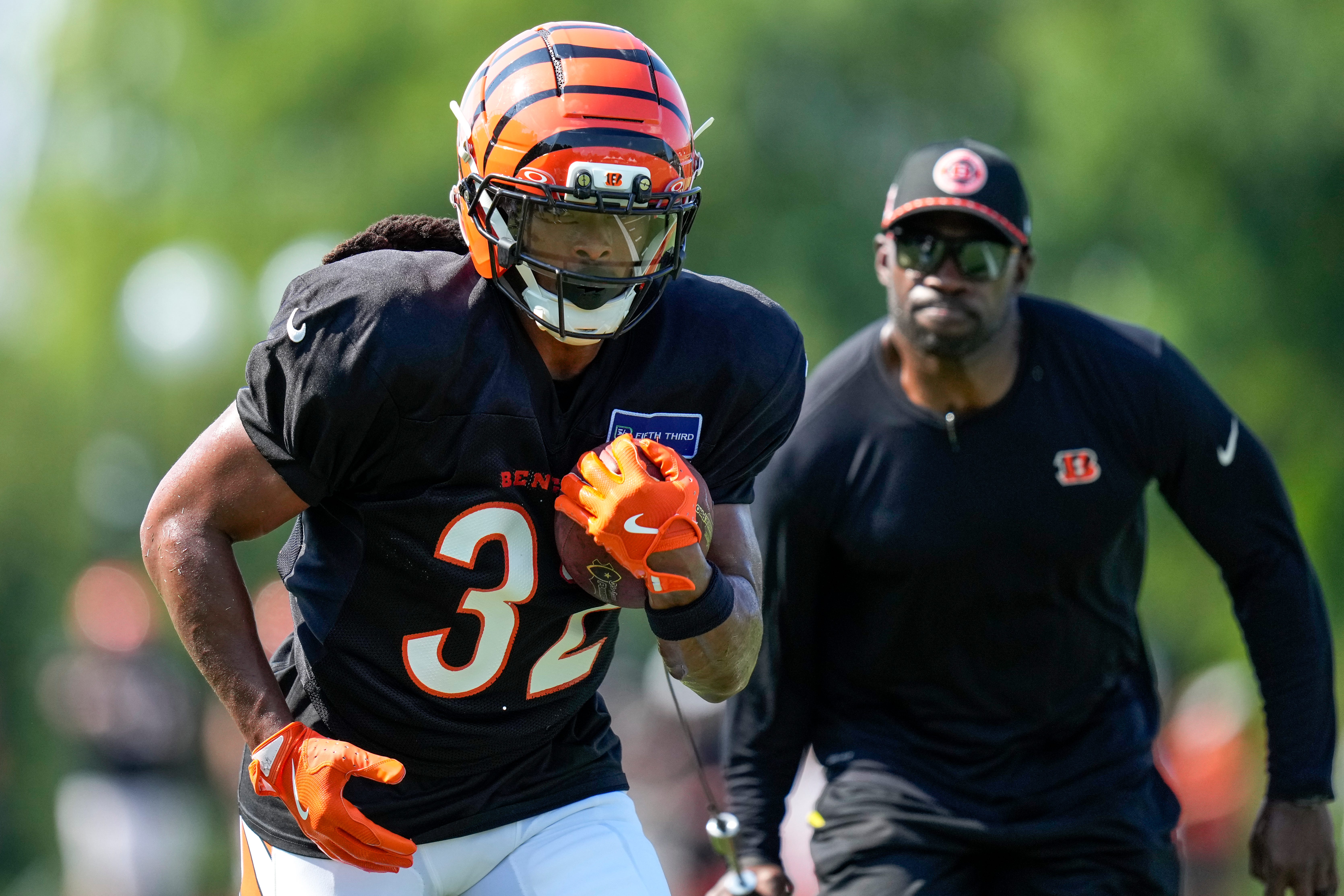 Cincinnati Bengals running back Gary Brightwell (32) runs through a drill during a preseason training camp practice in downtown Cincinnati on Wednesday, July 30, 2025.