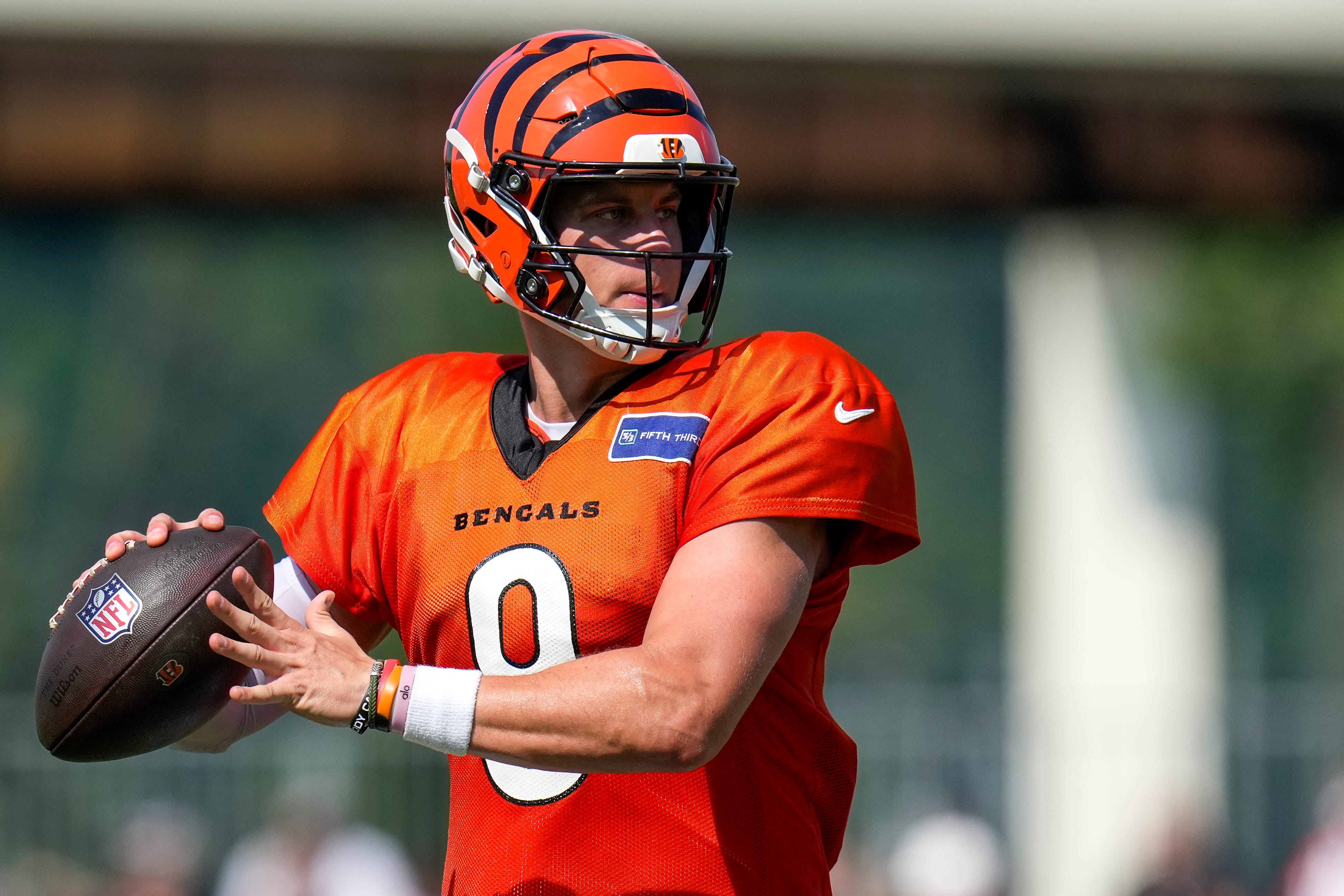 Cincinnati Bengals quarterback Joe Burrow (9) throws a pass during a preseason training camp practice in downtown Cincinnati on Wednesday, July 30, 2025.