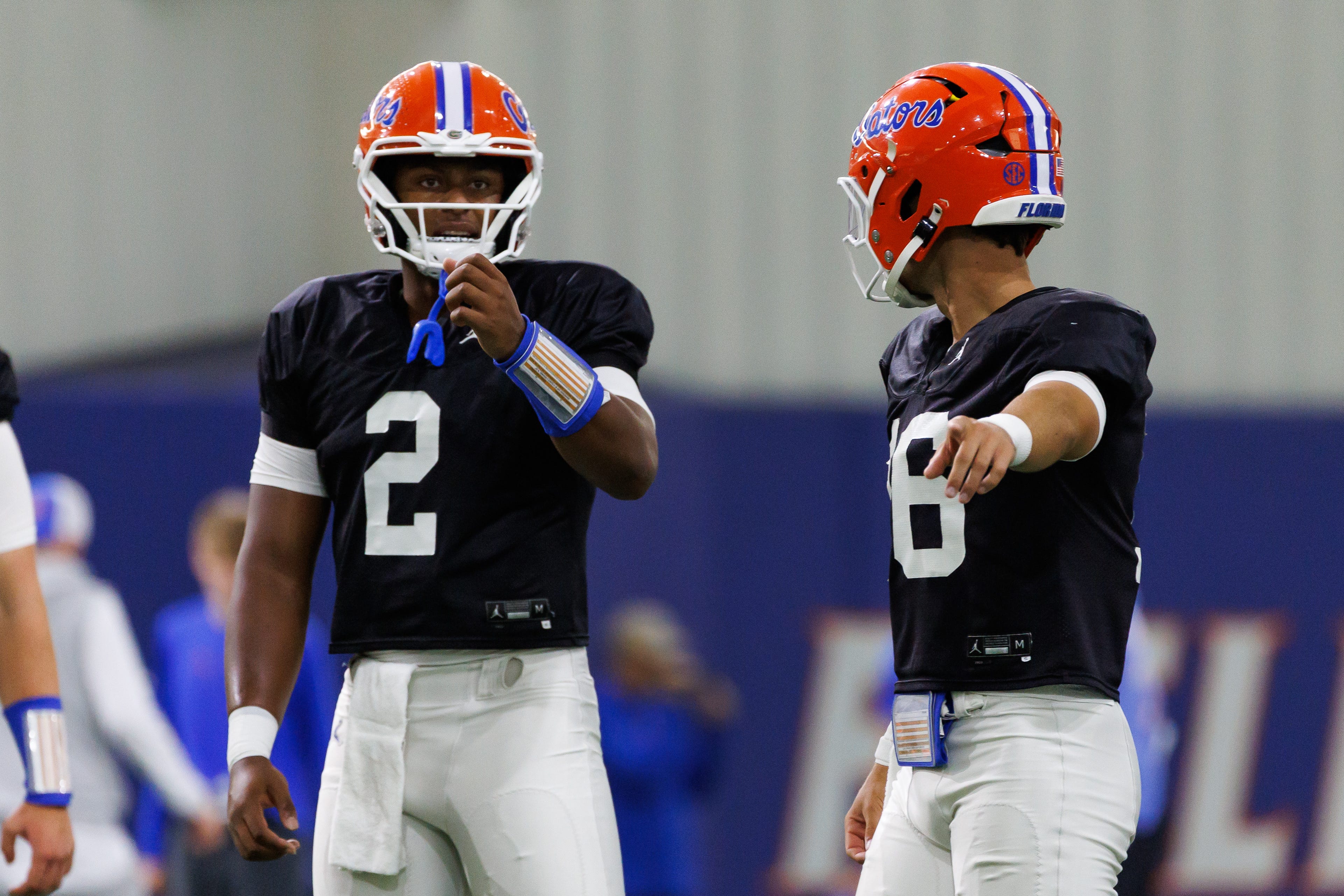 Florida Gators quarterback DJ Lagway (2) talks with Florida Gators quarterback Aidan Warner (16) during fall football practice at Sanders Indoor Practice Fields at the University of Florida in Gainesville, FL on Thursday, August 7, 2025.