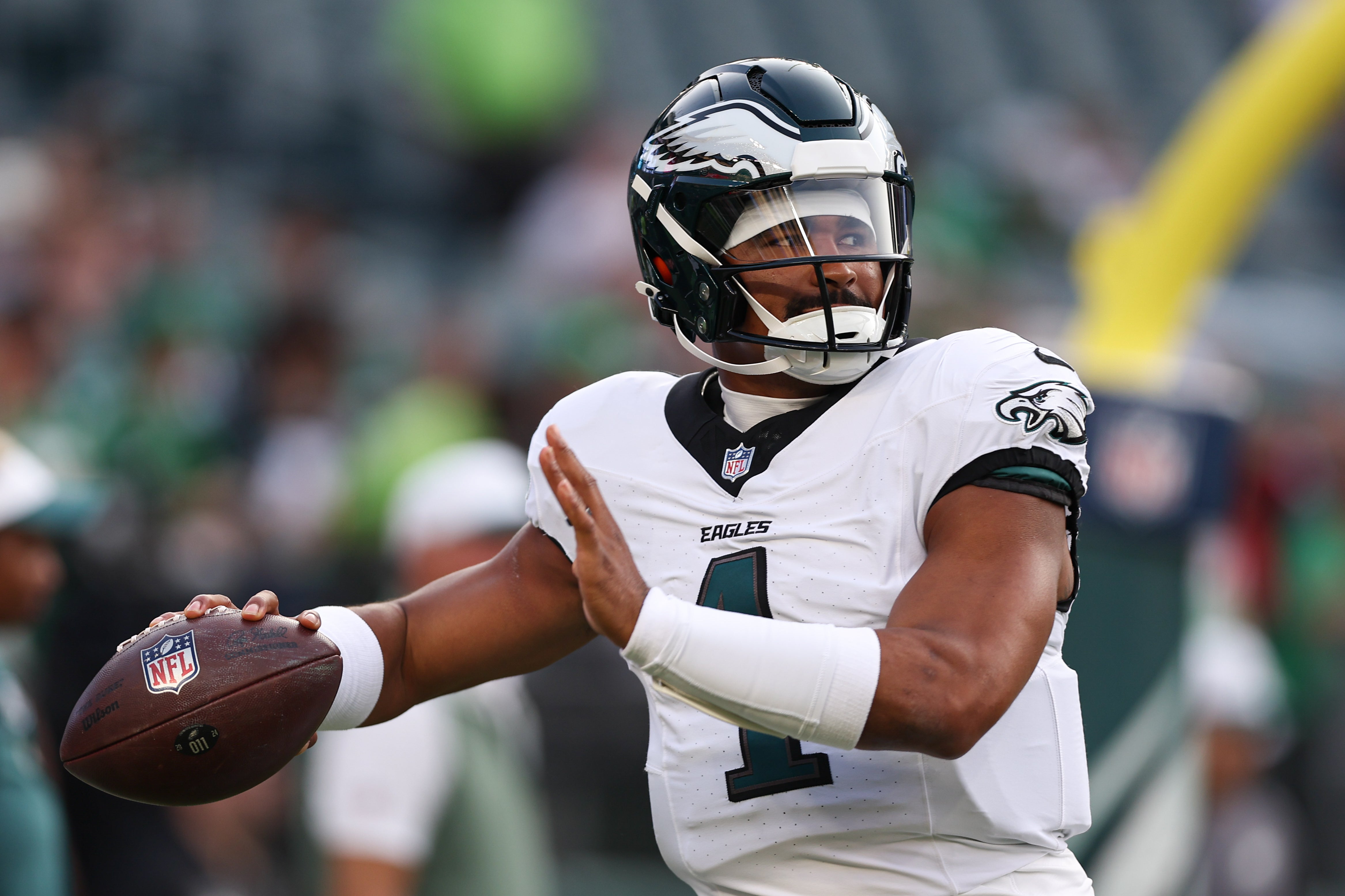 Philadelphia Eagles quarterback Jalen Hurts (1) throws the ball as he warms up before a game against the Cincinnati Bengals at Lincoln Financial Field. Bill Streicher-Imagn Images