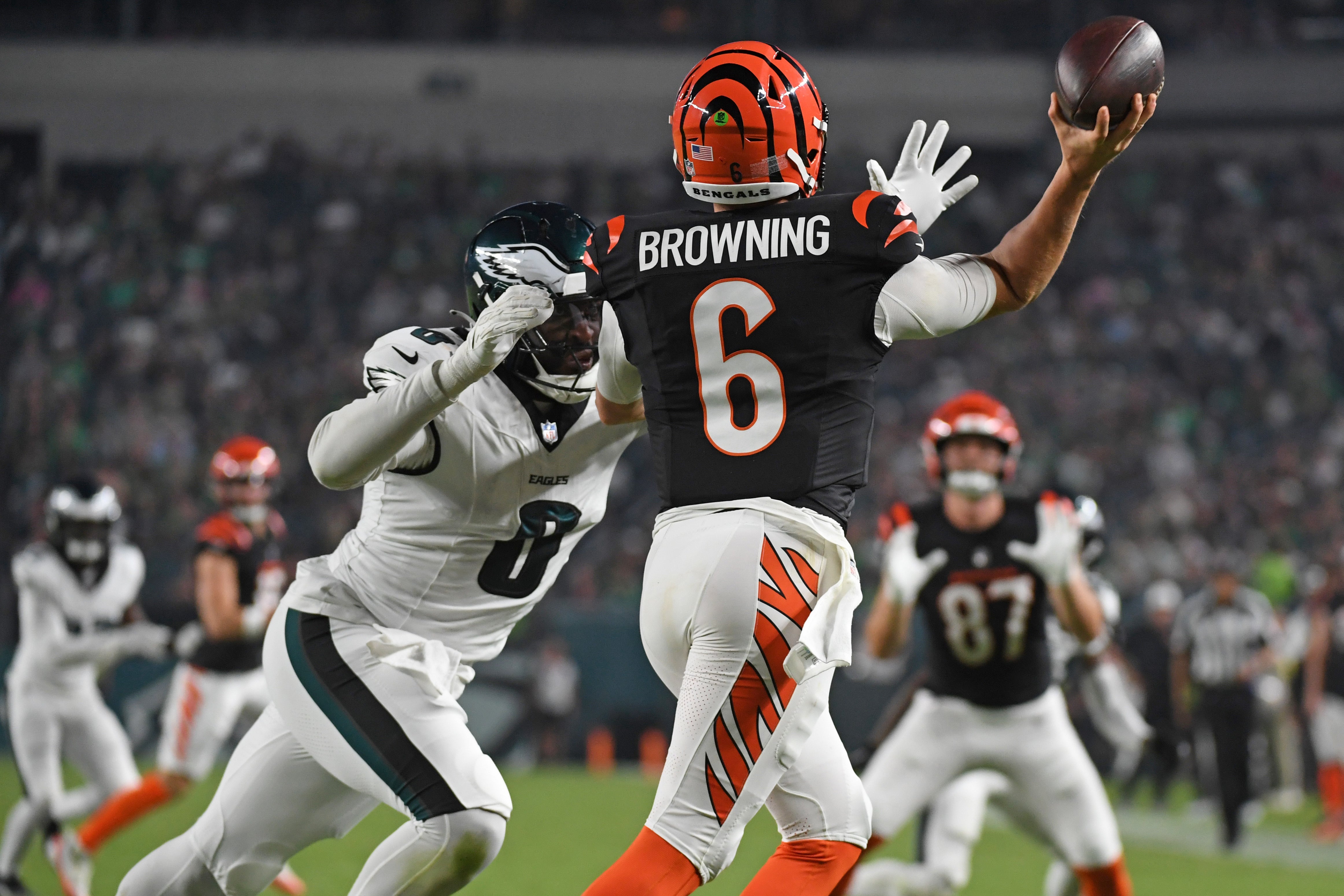 Aug 7, 2025; Philadelphia, Pennsylvania, USA; Philadelphia Eagles linebacker Joshua Uche (0) puts pressure on Cincinnati Bengals quarterback Jake Browning (6) during the second quarter at Lincoln Financial Field.