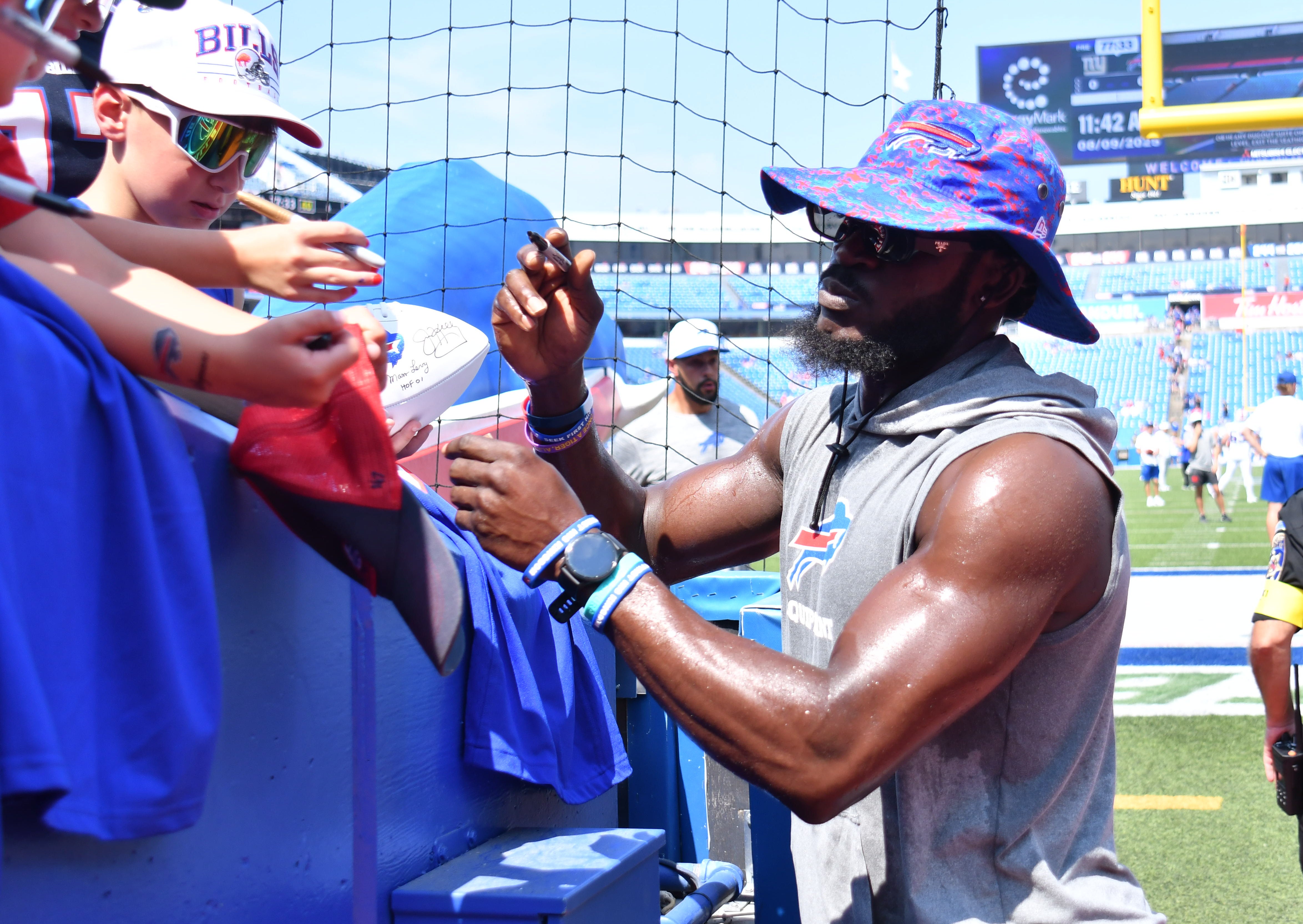 Buffalo Bills cornerback Tre White takes the time to sign autographs for Bills Mafia