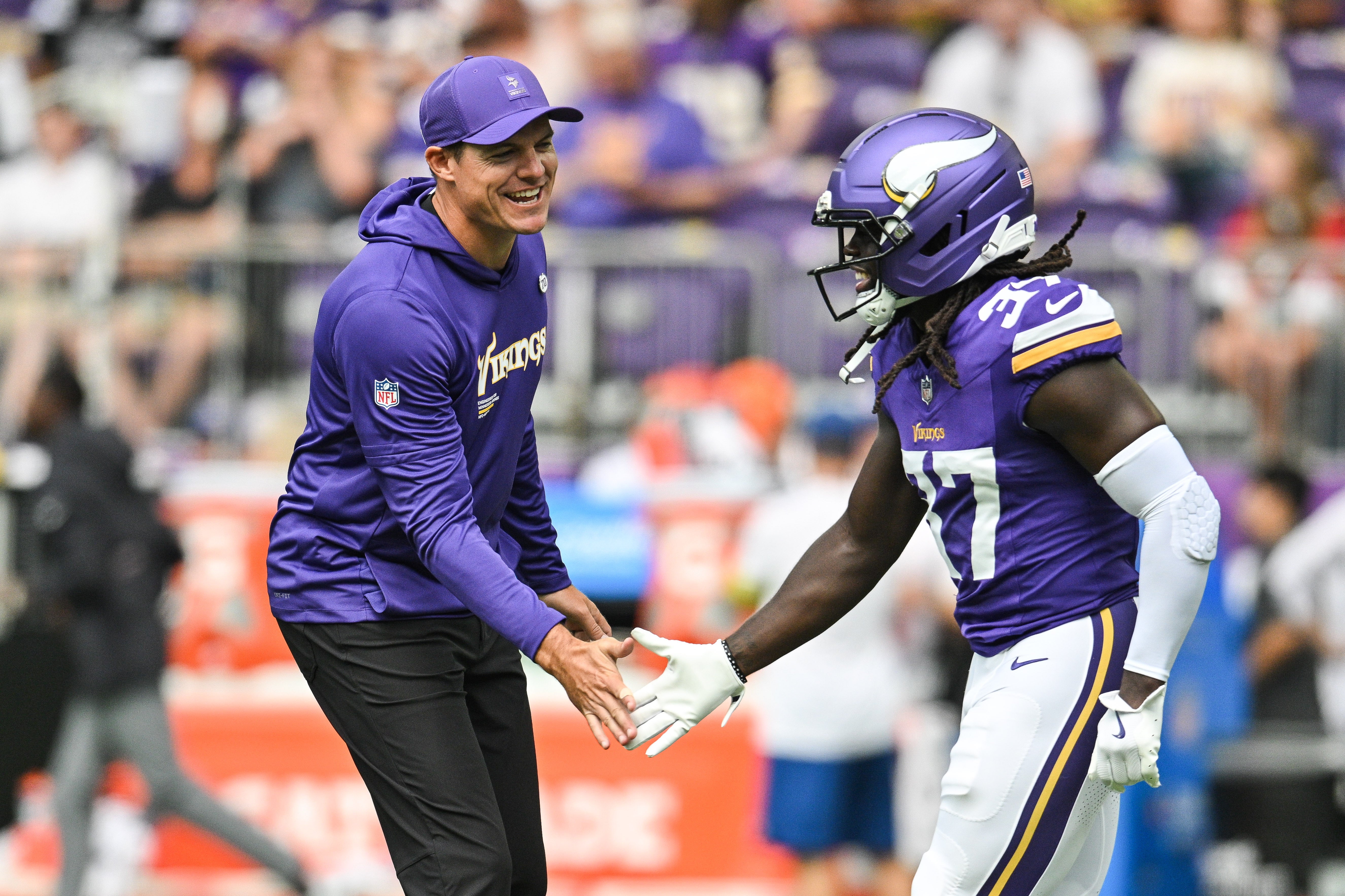Aug 9, 2025; Minneapolis, Minnesota, USA; Minnesota Vikings head coach Kevin O'Connell reacts with cornerback Tavierre Thomas (37) before the game against the Houston Texans at U.S. Bank Stadium.