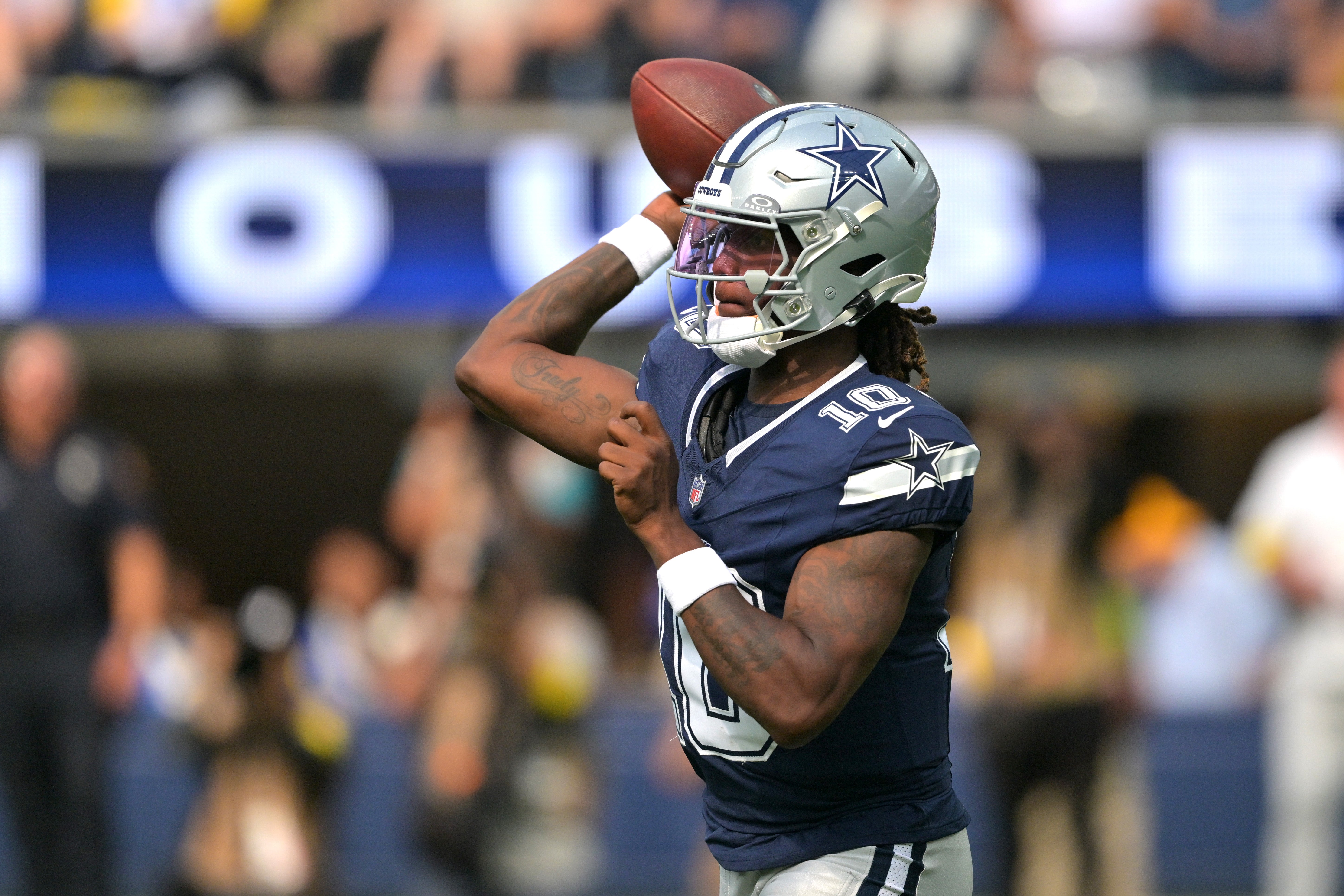 Dallas Cowboys quarterback Joe Milton III (10) throws a pass during the first half against the Los Angeles Rams at SoFi Stadium.