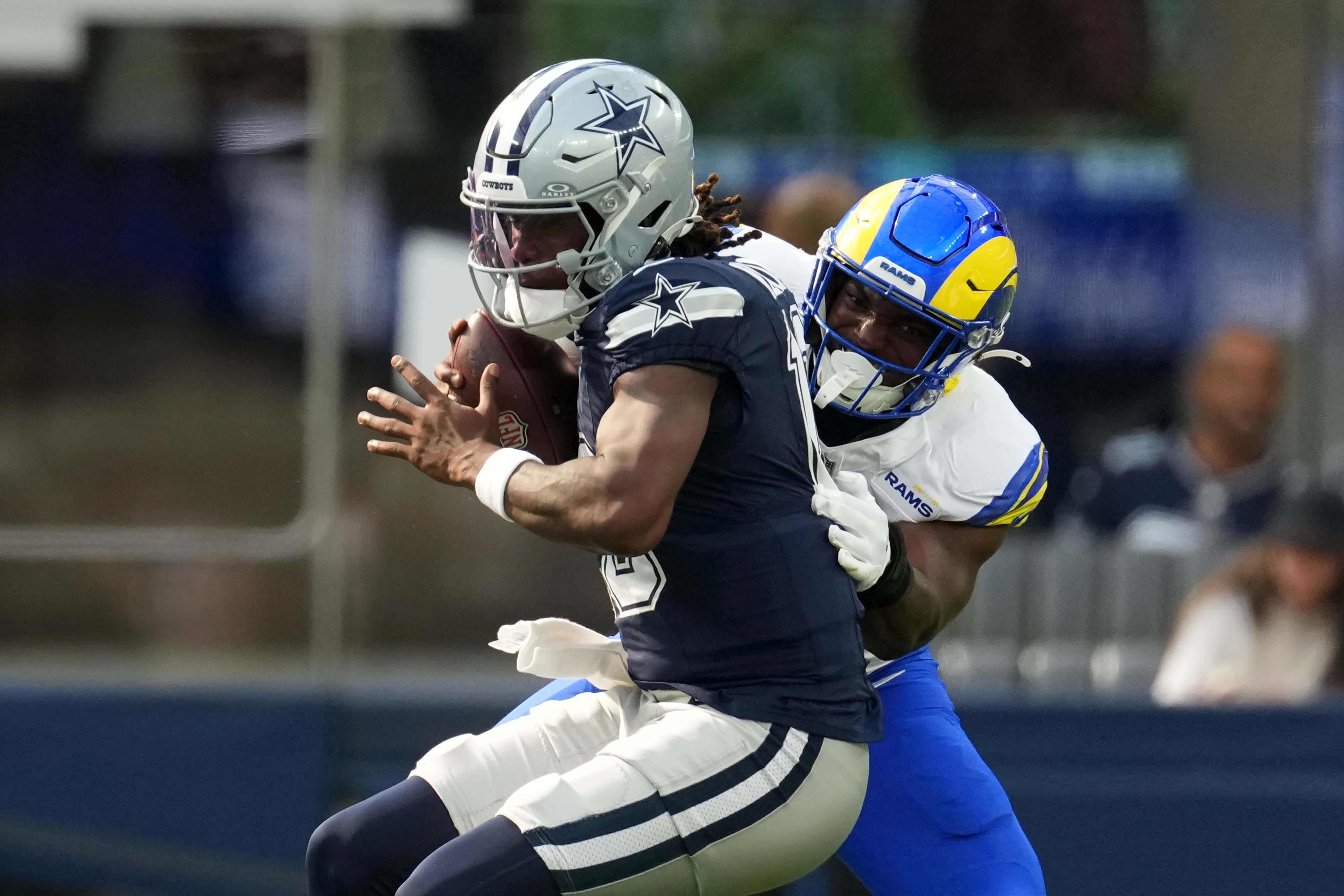 Aug 9, 2025; Inglewood, California, USA; Dallas Cowboys quarterback Joe Milton III (10) is sacked by Los Angeles Rams linebacker Josaiah Stewart (41) in the first half at SoFi Stadium.