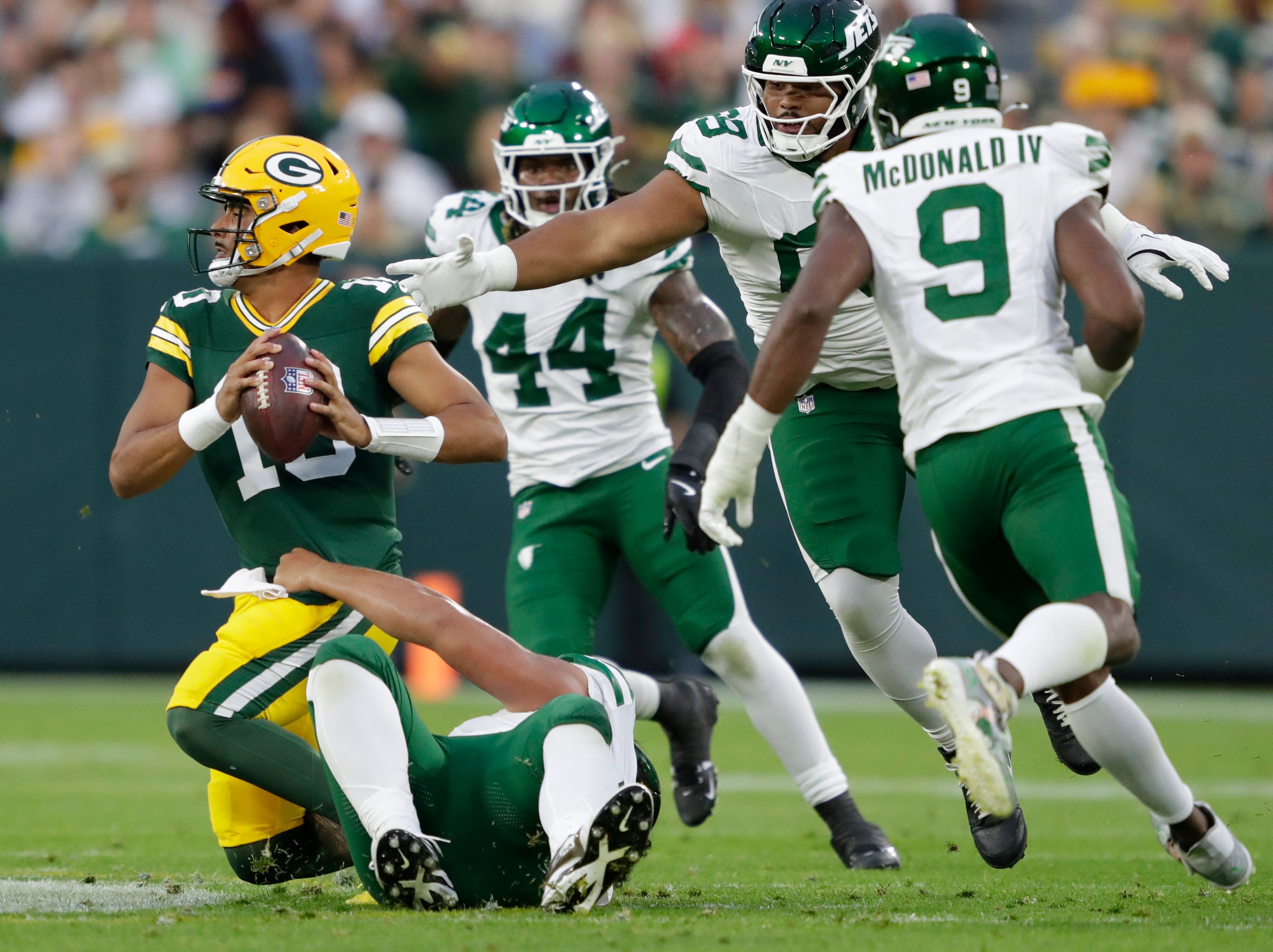 New York Jets defensive tackle Jay Tufele (78) sacks Green Bay Packers quarterback Jordan Love (10) during their preseason game on Saturday, Aug. 9, 2025, at Lambeau Field in Green Bay, Wisconsin.
