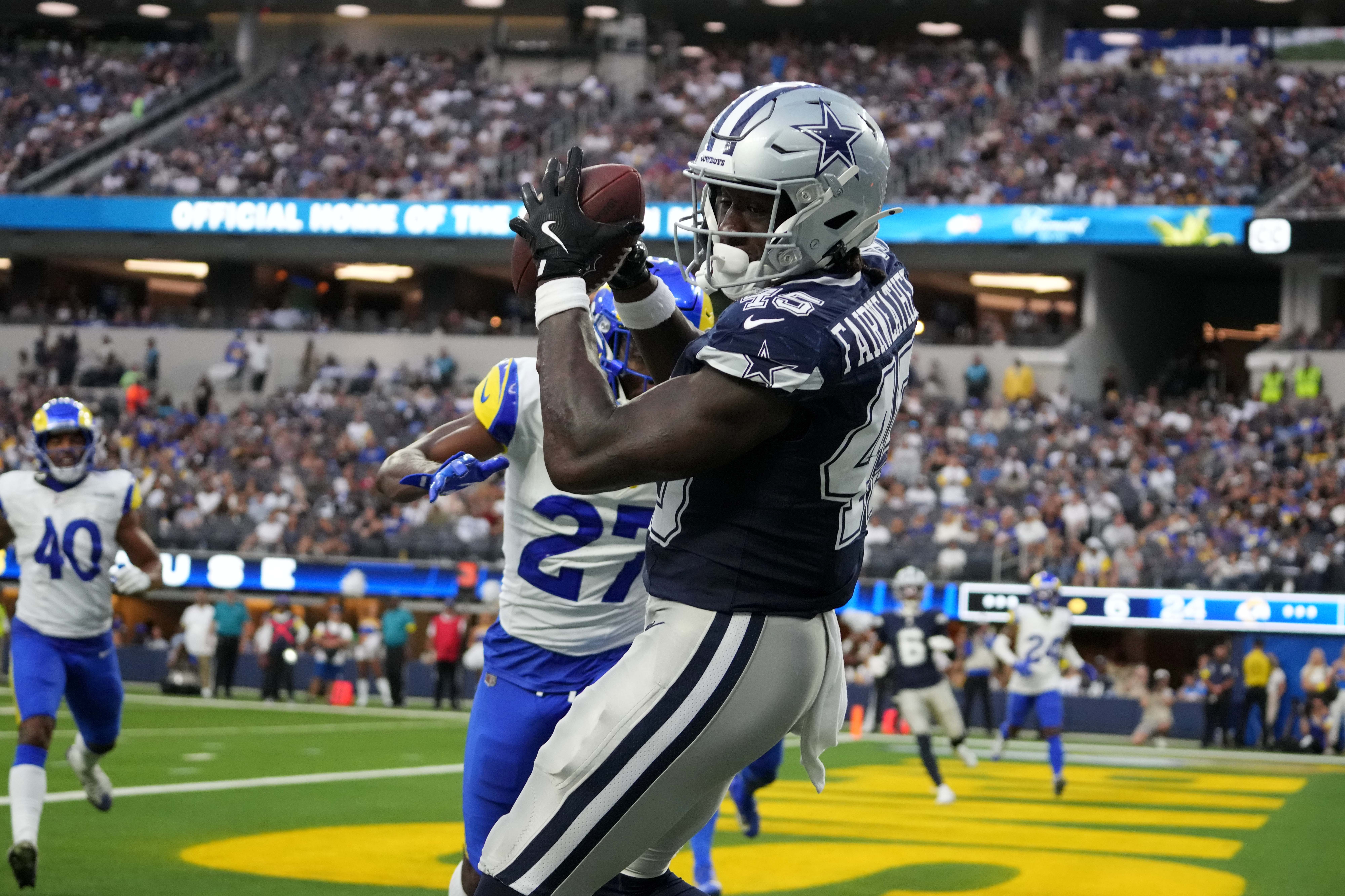 Dallas Cowboys tight end Rivaldo Fairweather (45) catches a 7-yard touchdown pass in the second half against Los Angeles Rams cornerback A.J. Green (27) at SoFi Stadium.