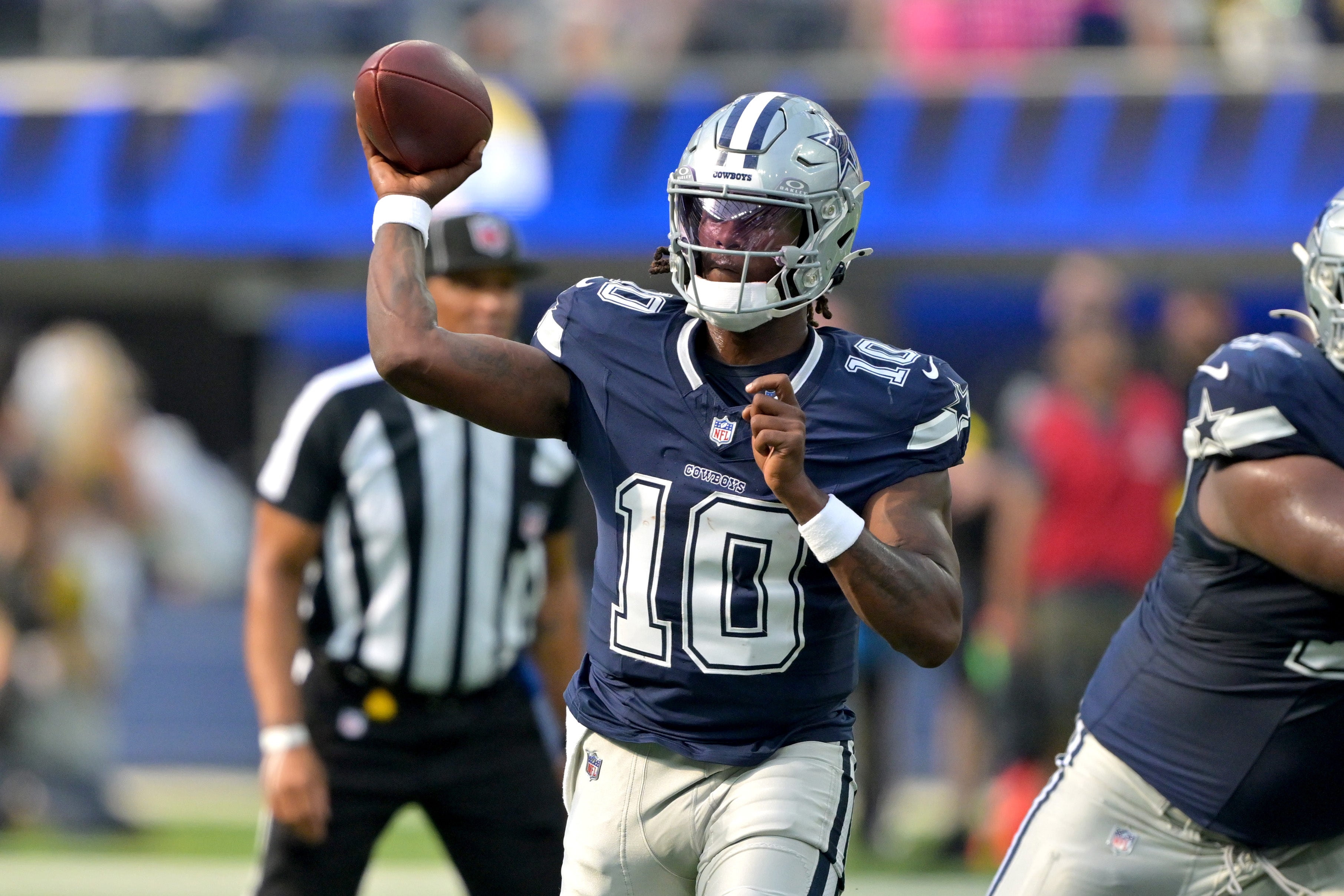 Dallas Cowboys quarterback Joe Milton III (10) throws a pass during the first half against the Los Angeles Rams at SoFi Stadium.