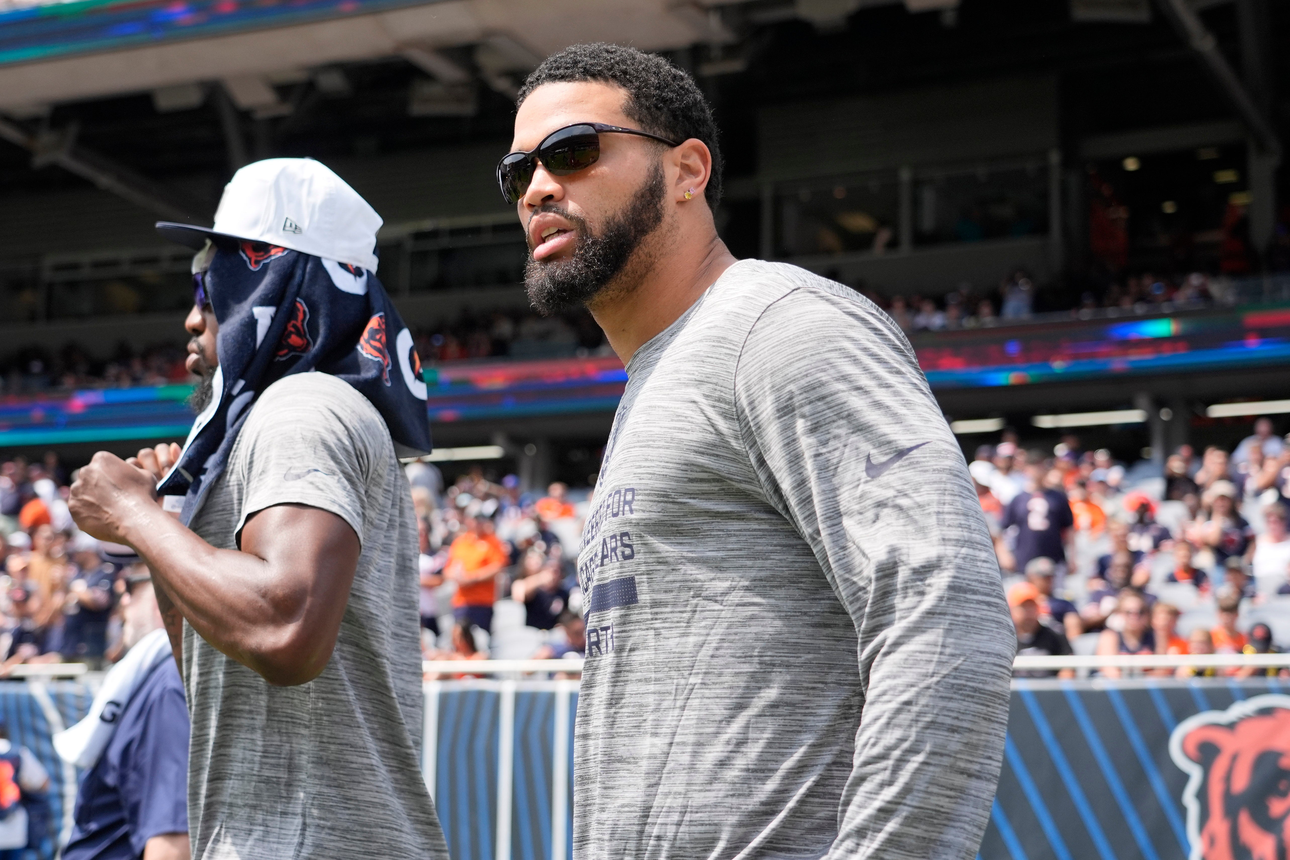Aug 10, 2025; Chicago, Illinois, USA; Chicago Bears quarterback Caleb Williams (18) takes the field against the Miami Dolphins at Soldier Field.