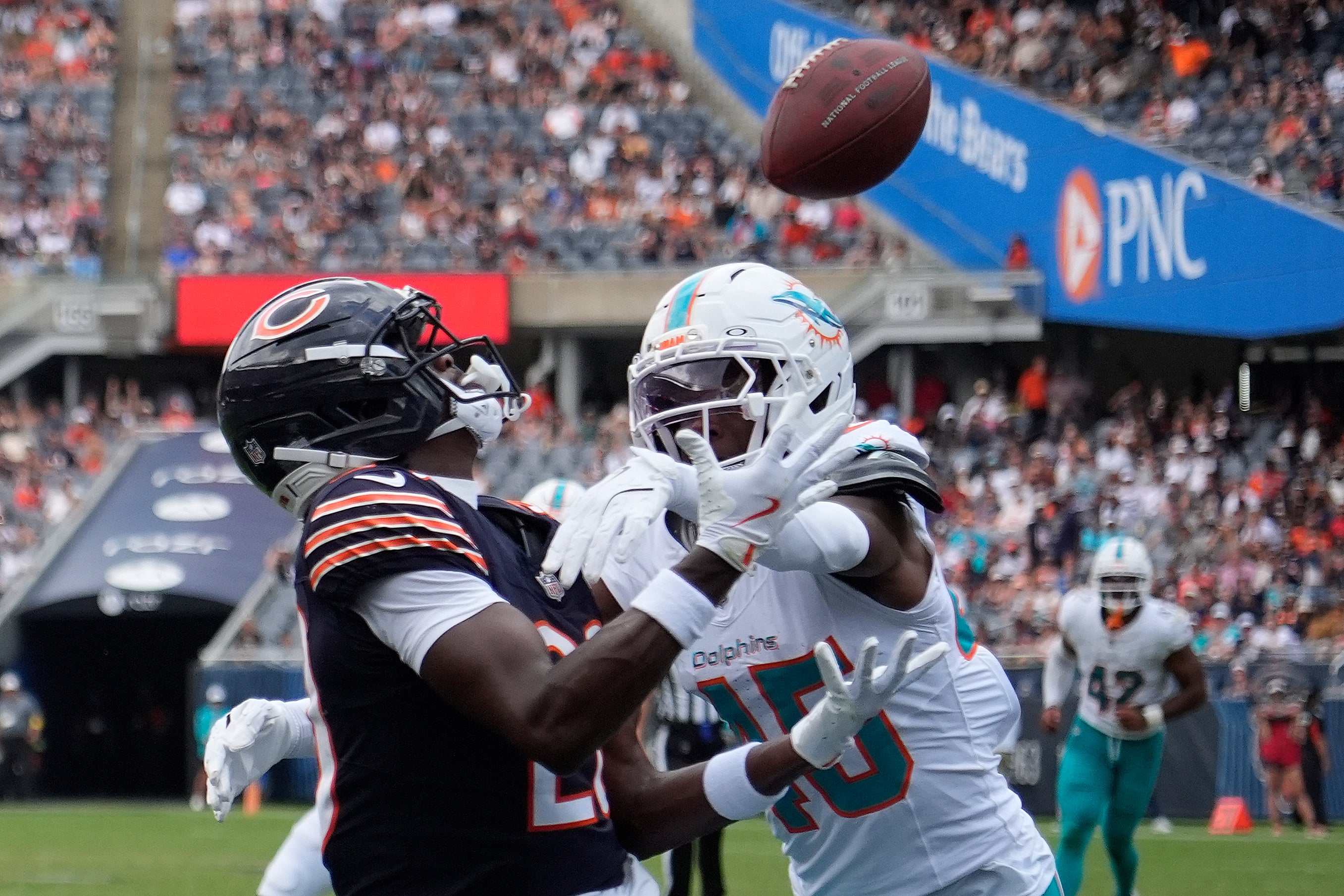 Aug 10, 2025; Chicago, Illinois, USA; Chicago Bears wide receiver Jahdae Walker (20) catches a touchdown pass as Miami Dolphins linebacker Jaelan Phillips (15) defends him during the second half at Soldier Field.