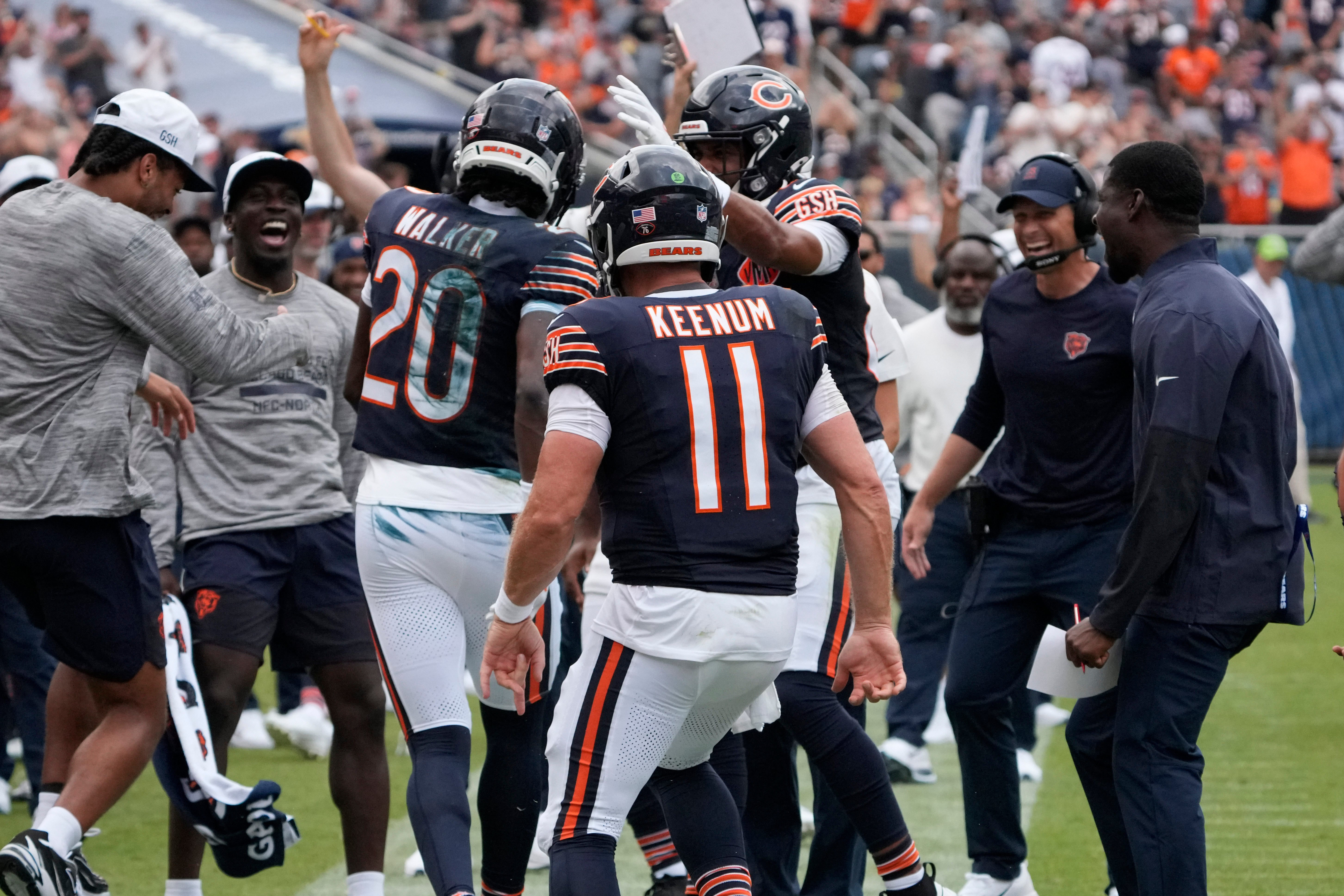 Aug 10, 2025; Chicago, Illinois, USA; Chicago Bears wide receiver Jahdae Walker (20) and quarterback Case Keenum (11) celebrate a touchdown against the Miami Dolphins during the second half at Soldier Field.