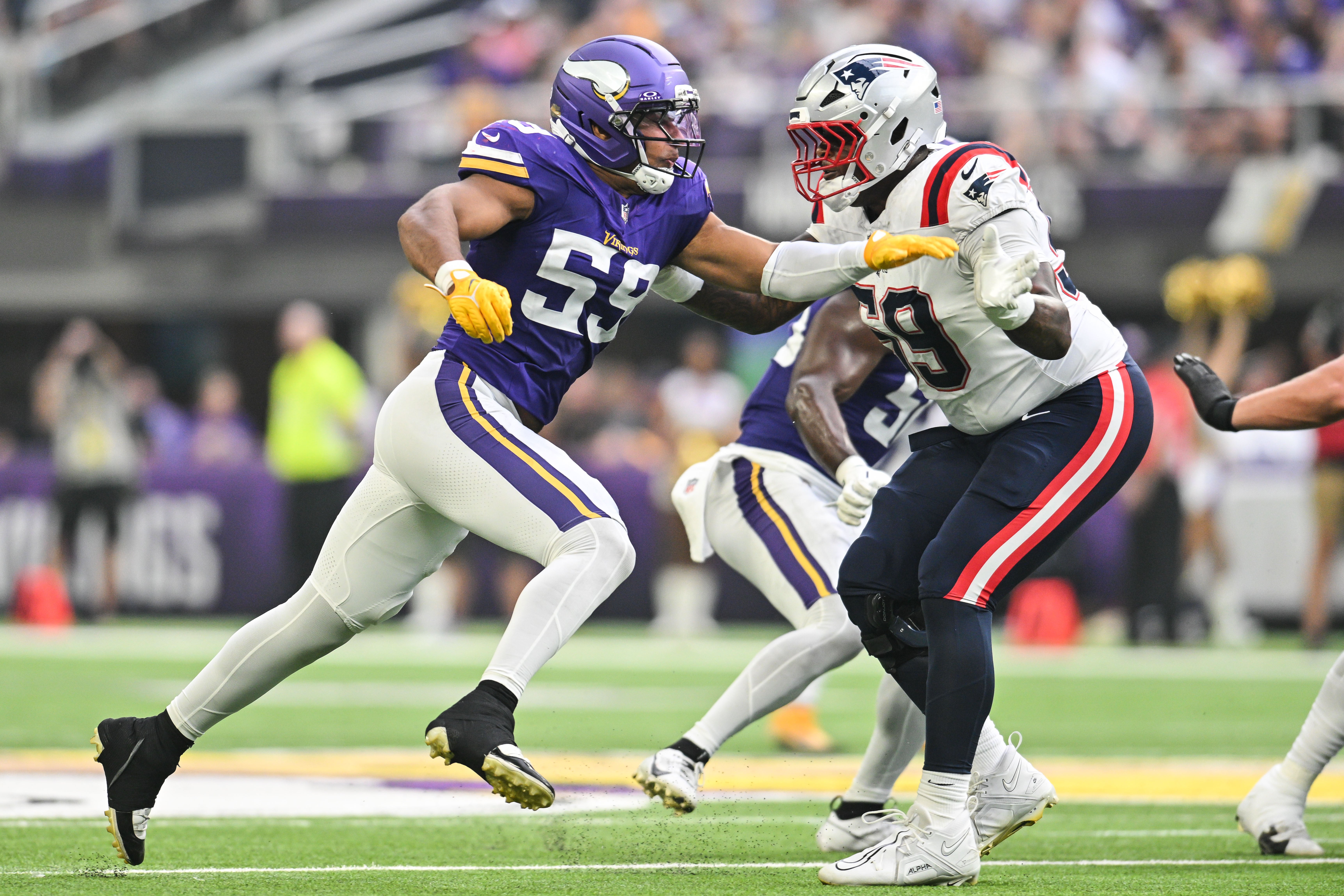 Aug 16, 2025; Minneapolis, Minnesota, USA; Minnesota Vikings linebacker Gabriel Murphy (59) rushes the passer as New England Patriots offensive tackle Vederian Lowe (59) blocks during the second quarter at U.S. Bank Stadium.