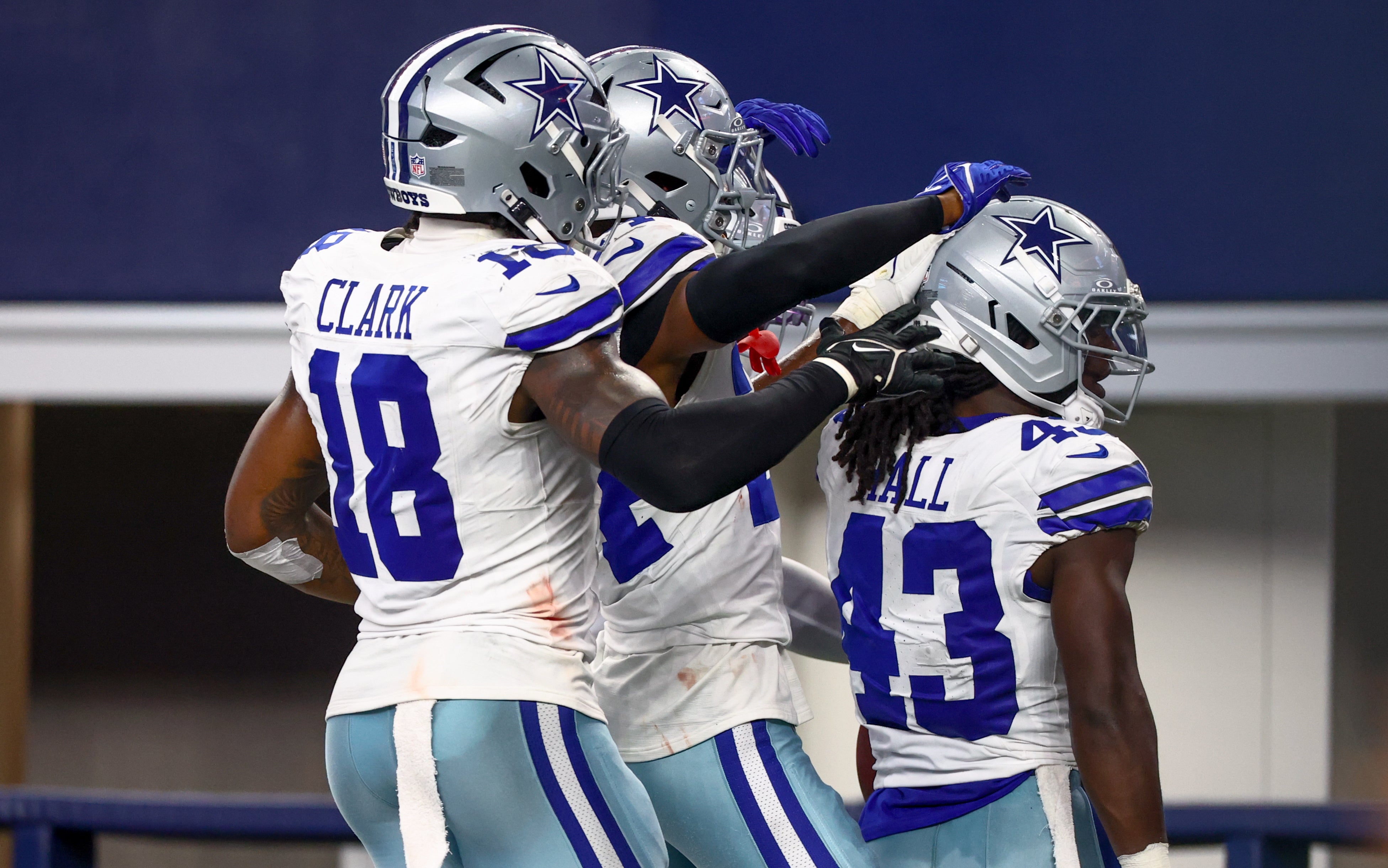 Dallas Cowboys cornerback Kemon Hall (43) celebrates with teammates after making an interception during the second quarter against the Baltimore Ravens at AT&T Stadium.