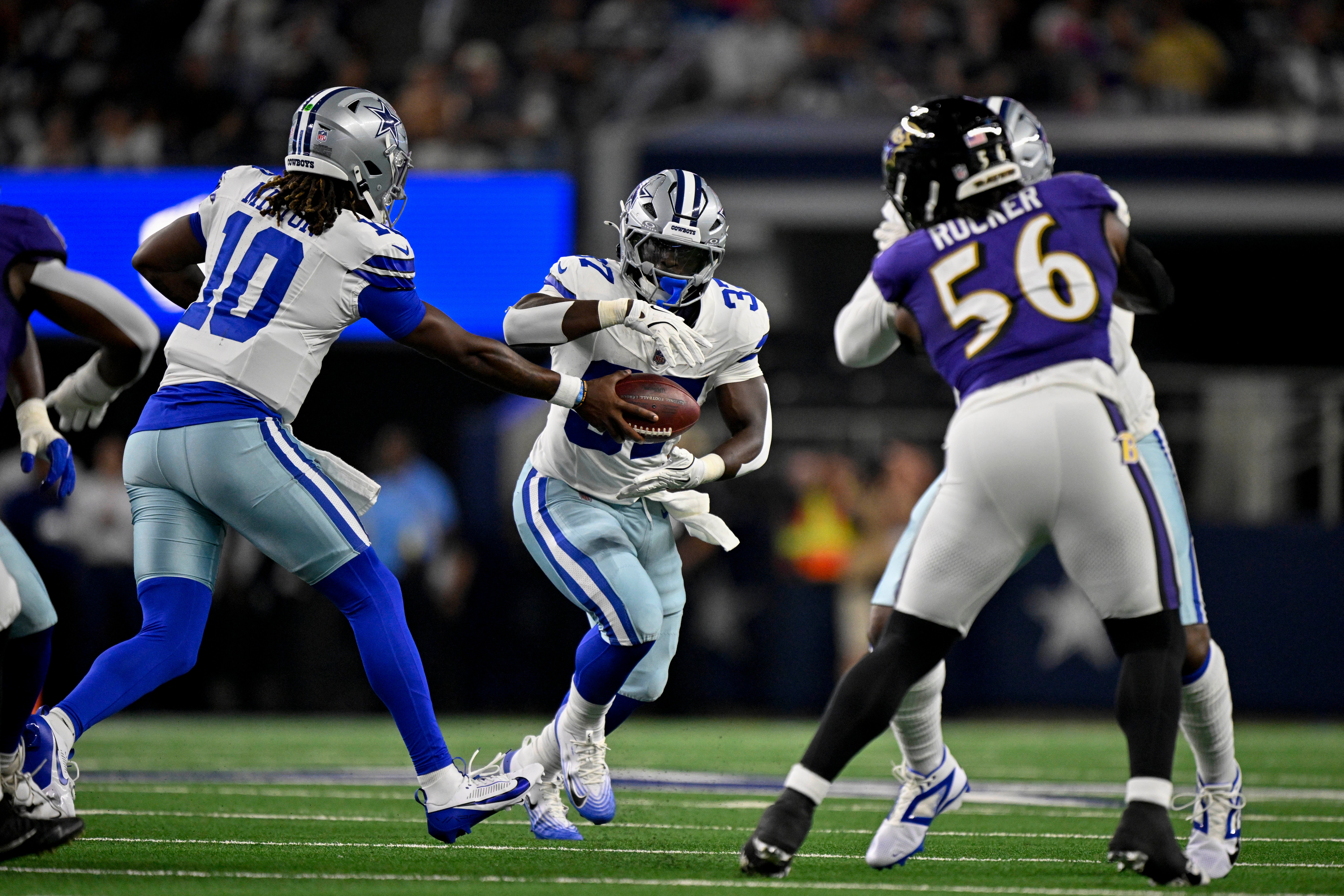 Dallas Cowboys quarterback Joe Milton III (10) and running back Phil Mafah (37) during the game between the Dallas Cowboys and the Baltimore Ravens at AT&T Stadium.