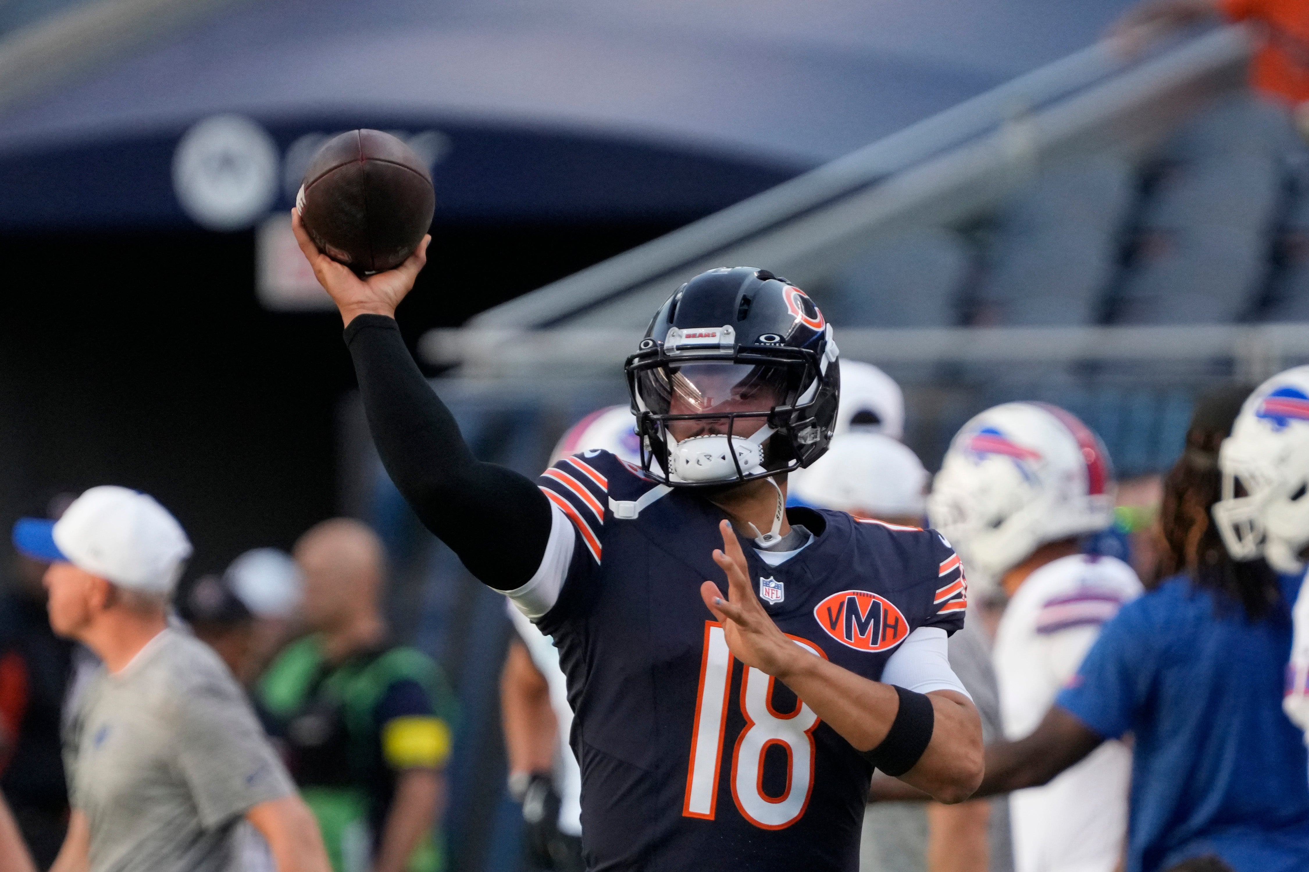 Aug 17, 2025; Chicago, Illinois, USA; Chicago Bears quarterback Caleb Williams (18) warms up before a game against the Buffalo Bills at Soldier Field.