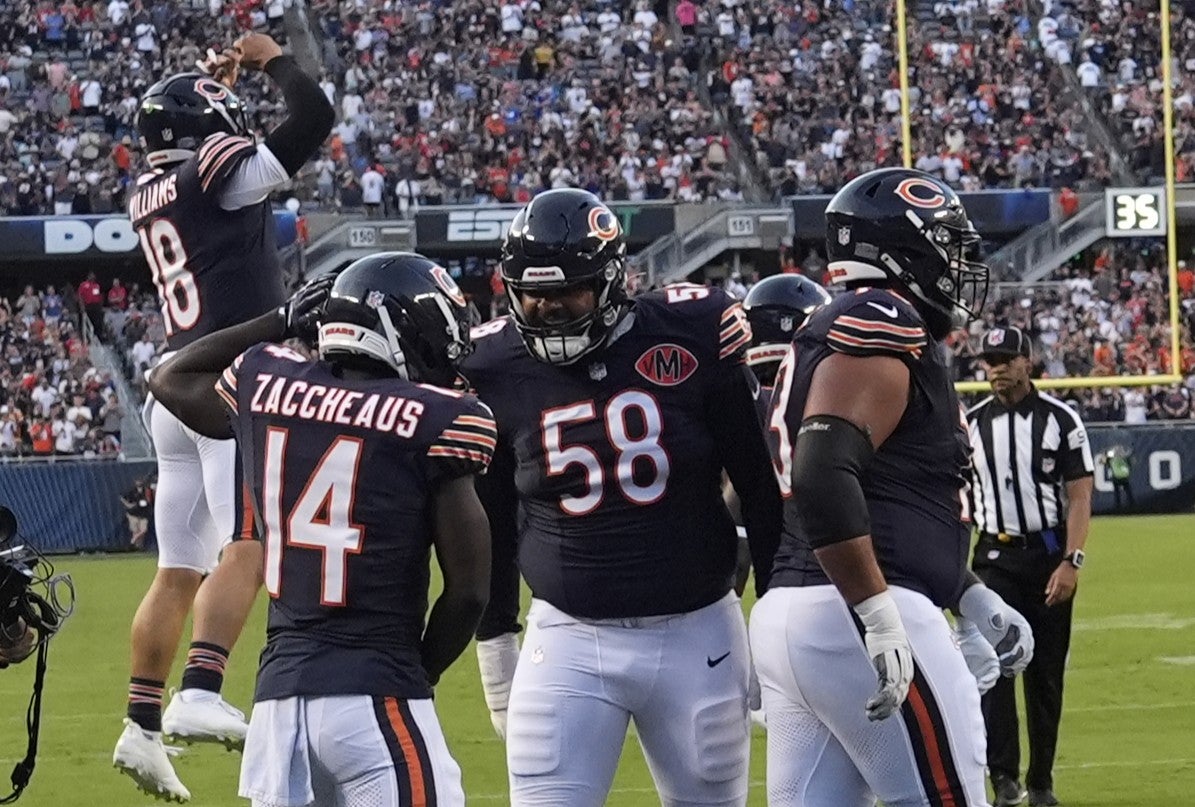 Aug 17, 2025; Chicago, Illinois, USA; Chicago Bears wide receiver Olamide Zaccheaus (14) celebrates his touchdown reception against the Buffalo Bills during the first quarter at Soldier Field.
