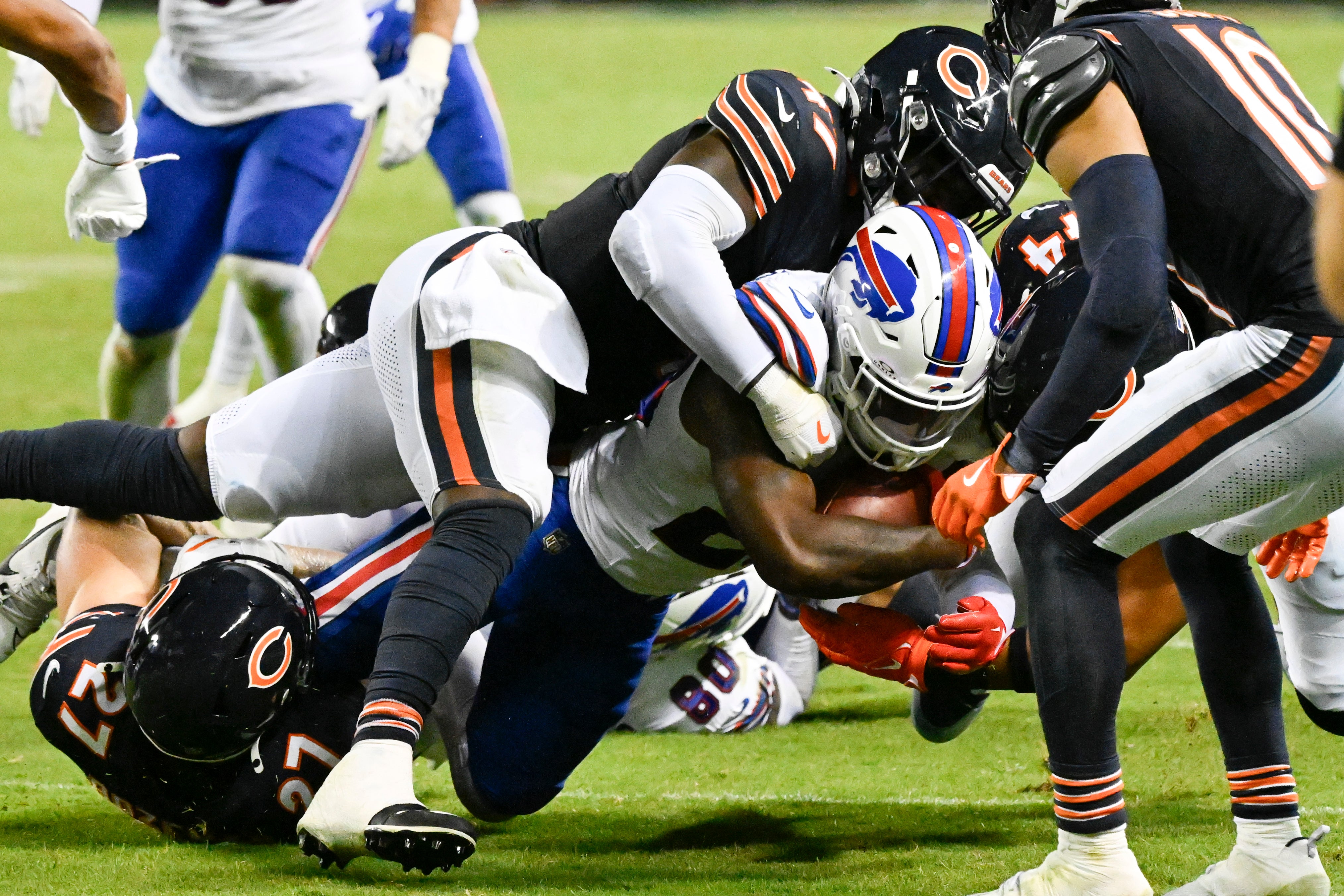 Aug 17, 2025; Chicago, Illinois, USA; Buffalo Bills cornerback Brandon Codrington (29) runs the ball against Chicago Bears linebacker Ruben Hyppolite II (47) during the second half at Soldier Field.