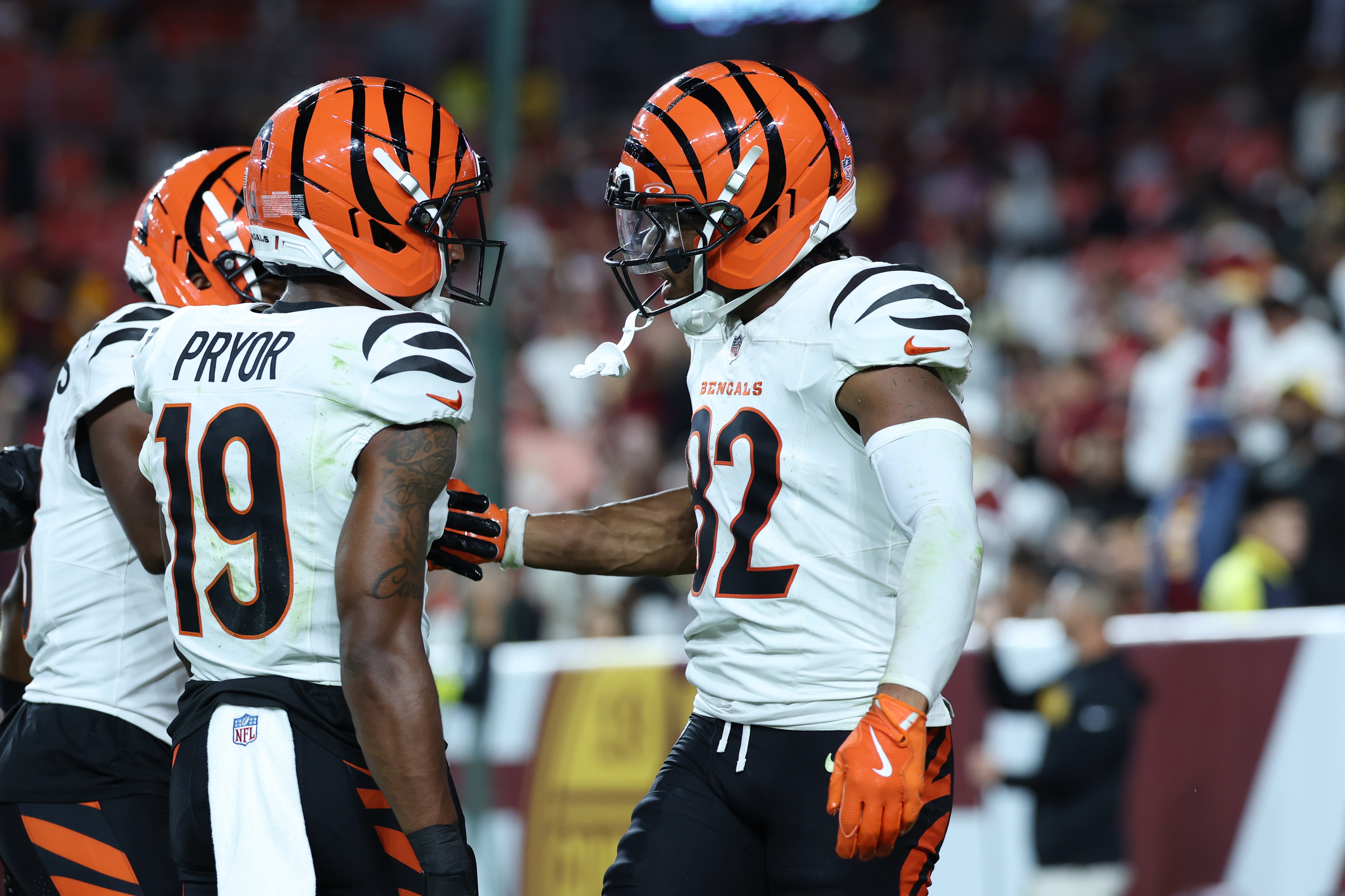 Aug 18, 2025; Landover, Maryland, USA; Cincinnati Bengals wide receiver Mitchell Tinsley (82) celebrates with teammates after scoring a touchdown against the Washington Commanders during the first half at Northwest Stadium.