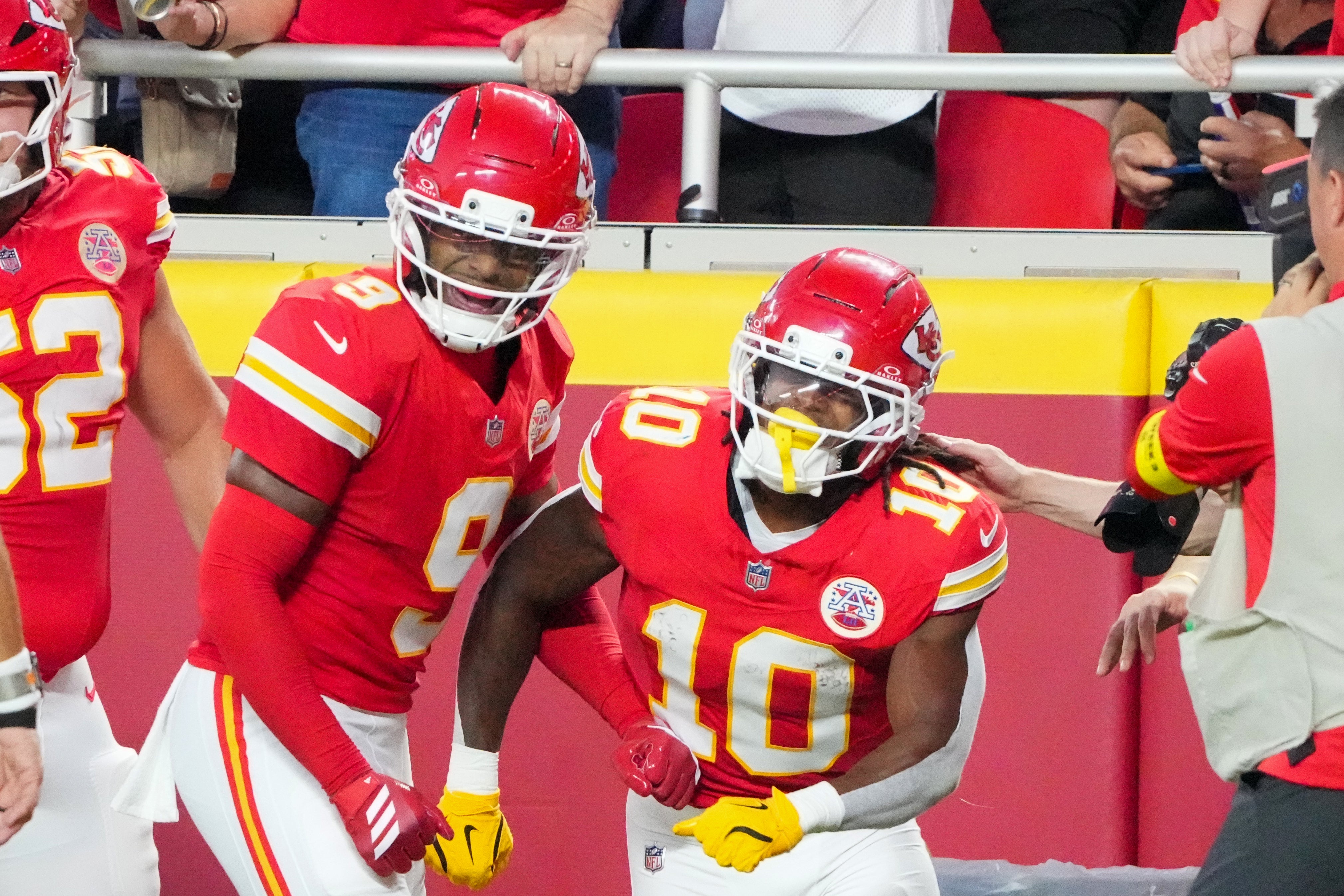 Kansas City Chiefs running back Isiah Pacheco (10) celebrates with wide receiver JuJu Smith-Schuster (9) against the Chicago Bears after a run during the first half of the game at GEHA Field at Arrowhead Stadium.