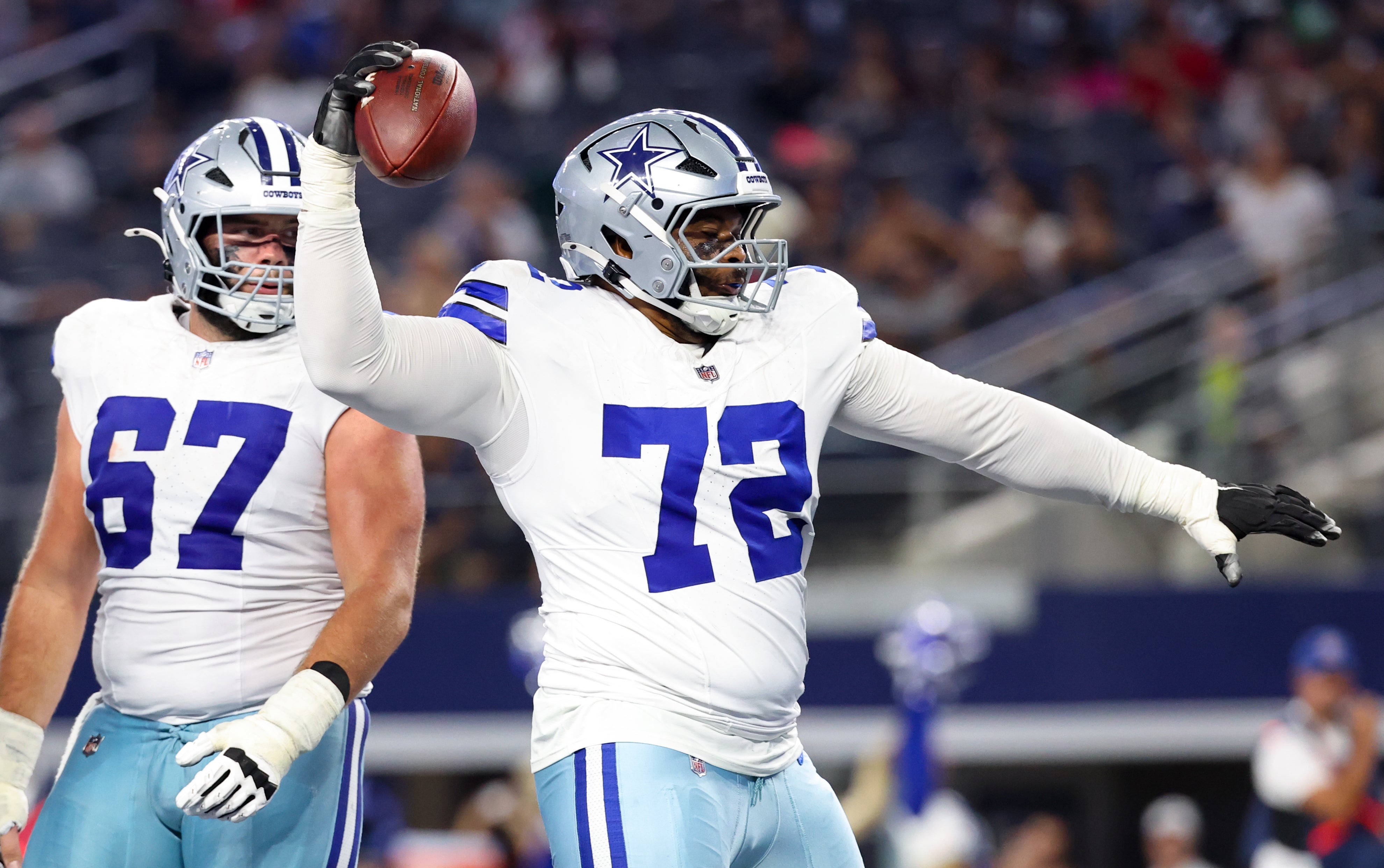 Dallas Cowboys guard La'el Collins (72) spikes the football after a touchdown during the second half against the Atlanta Falcons at AT&T Stadium.