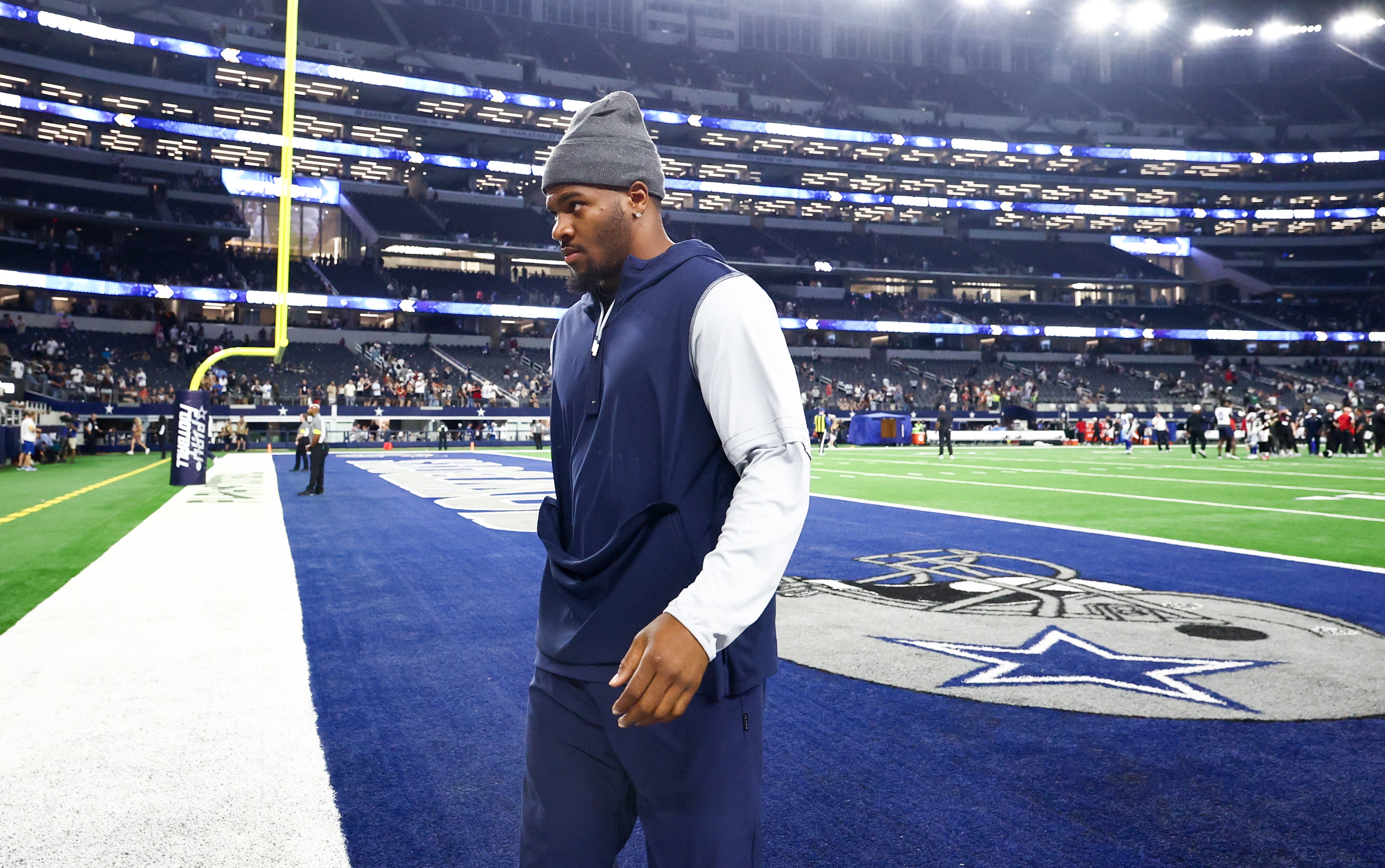 Dallas Cowboys defensive end Micah Parsons walks off the field after the game against the Atlanta Falcons at AT&T Stadium.