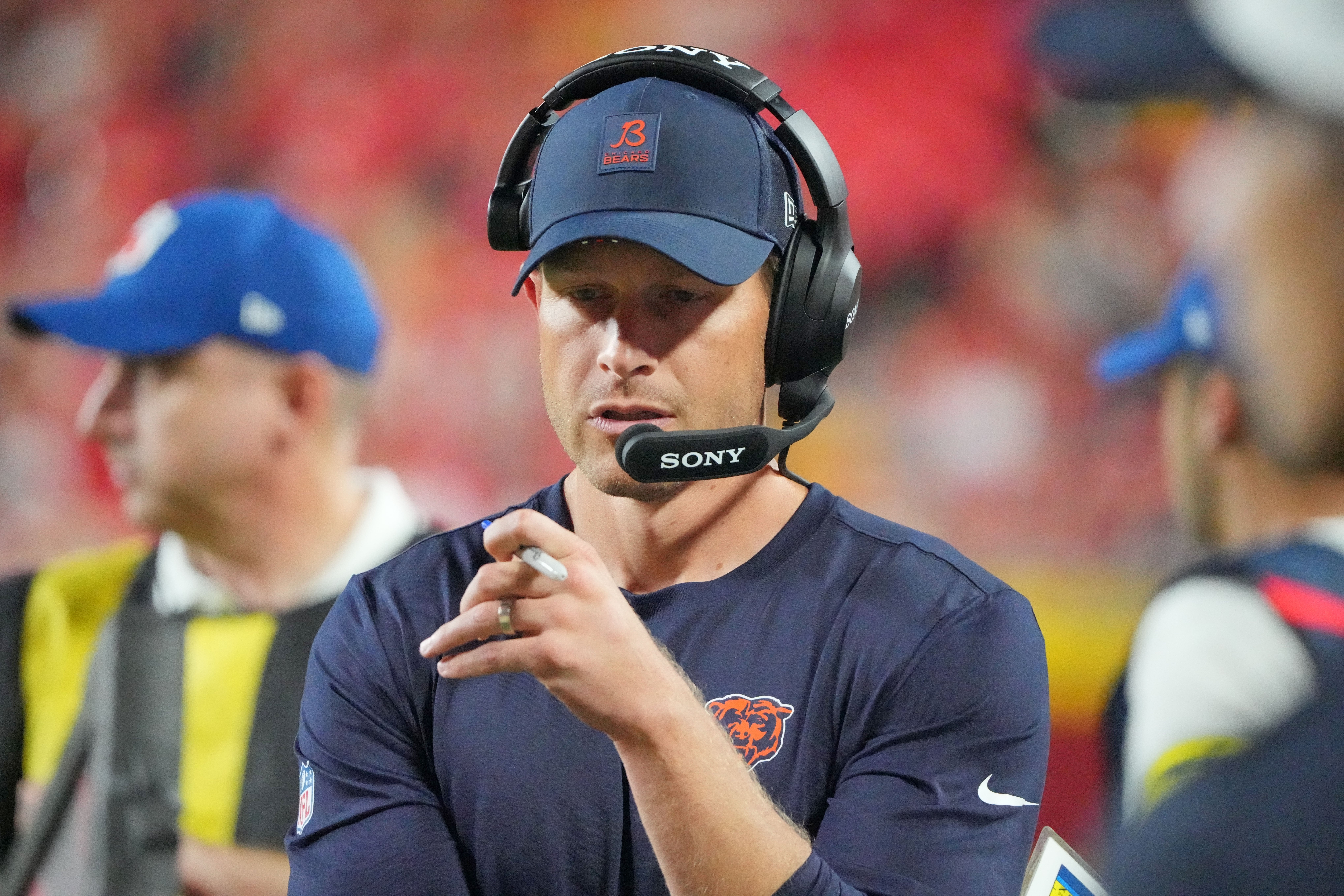 Aug 22, 2025; Kansas City, Missouri, USA; Chicago Bears head coach Ben Johnson on field against the Kansas City Chiefs during the second half of the game at GEHA Field at Arrowhead Stadium.